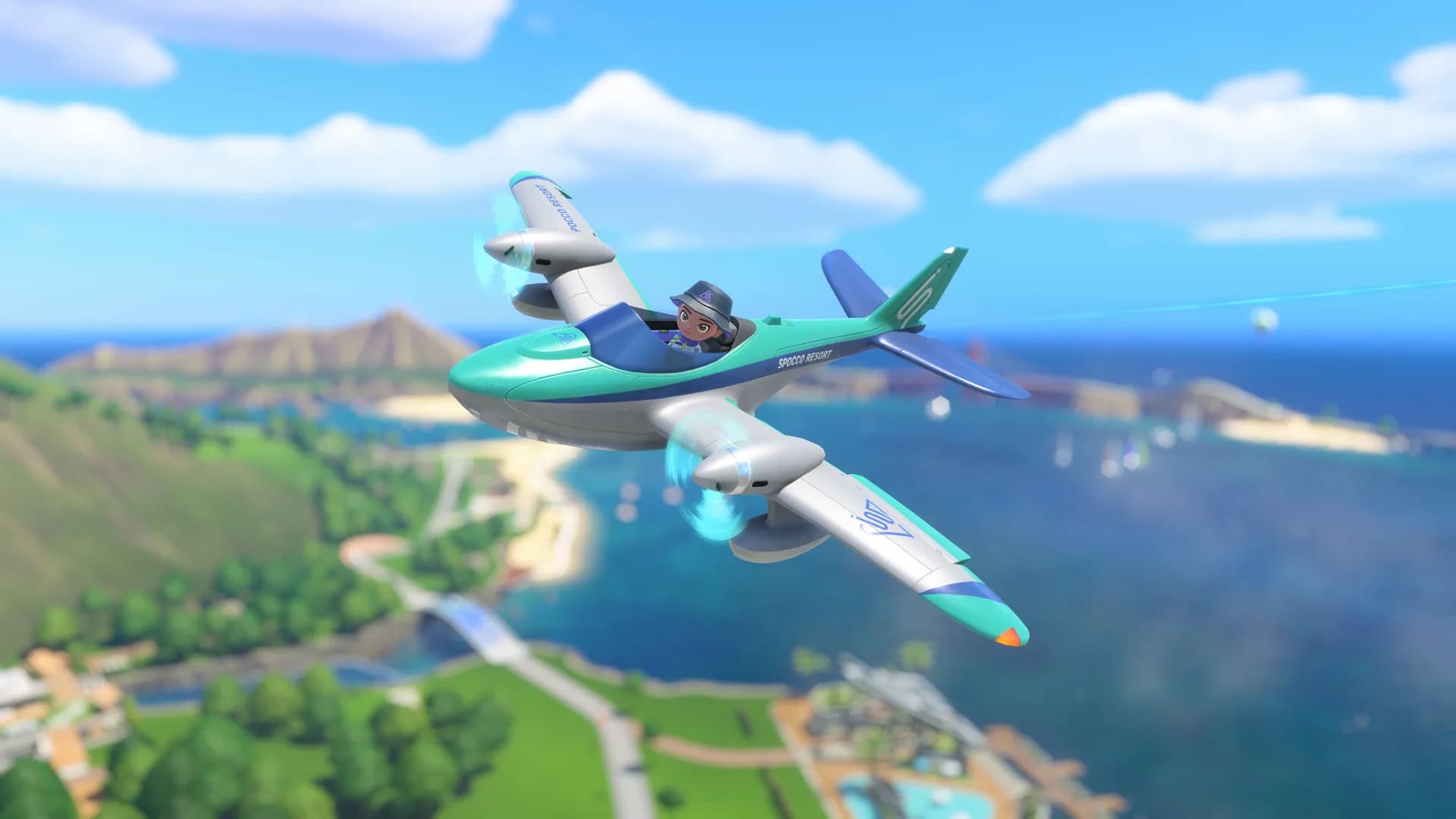 A player's Joy-Con controllers alongside artwork of Wuhu Island from Nintendo Switch Sports Resort, showing a plane, skateboarder and jet ski.