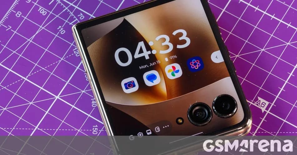 Motorola Razr Ultra flip phone unfolded showing Android home screen