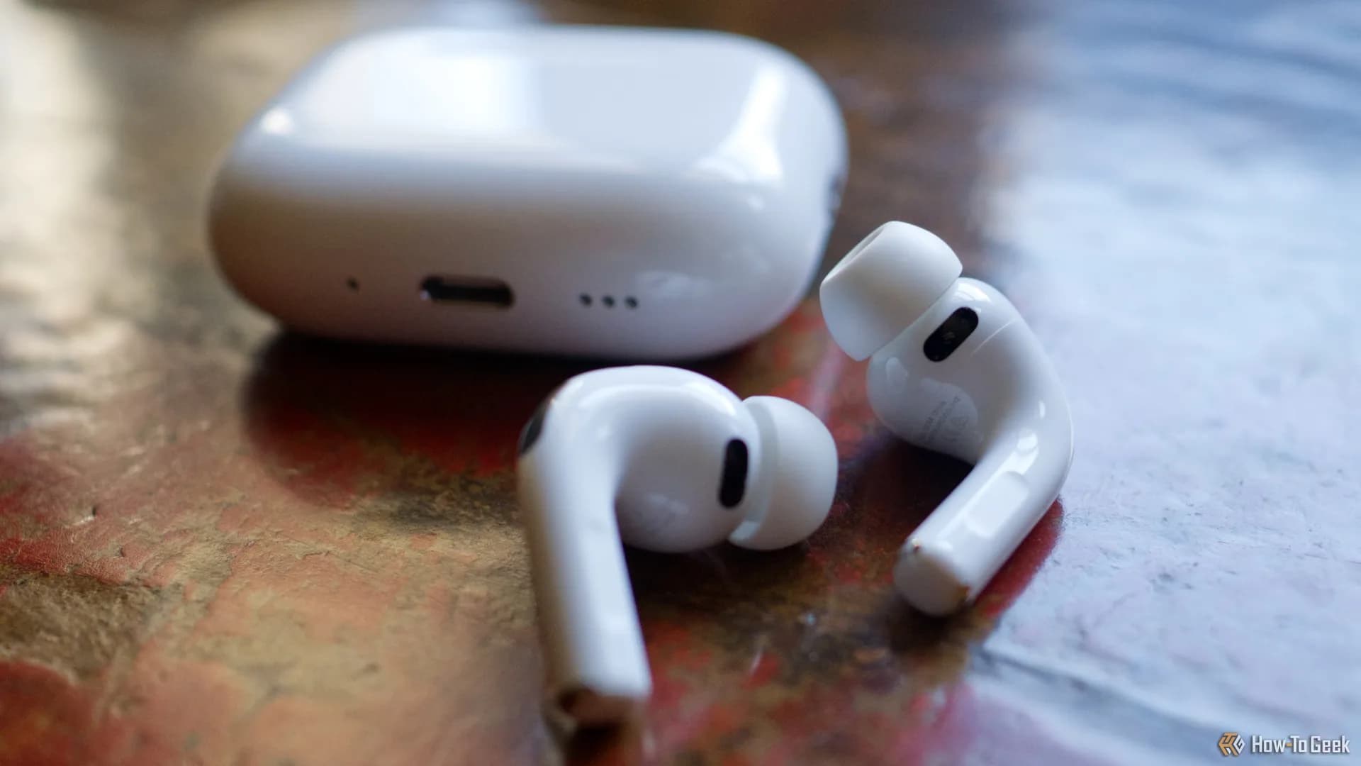 Apple AirPods Pro 3 in white on a clean surface, charging case open