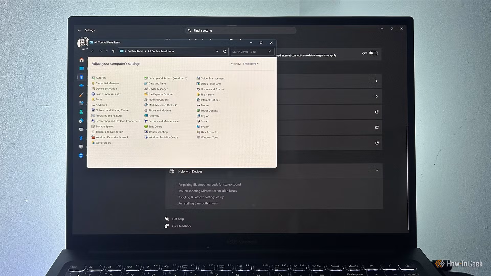 Windows 11 desktop showing the modern Settings app alongside an older Control Panel window