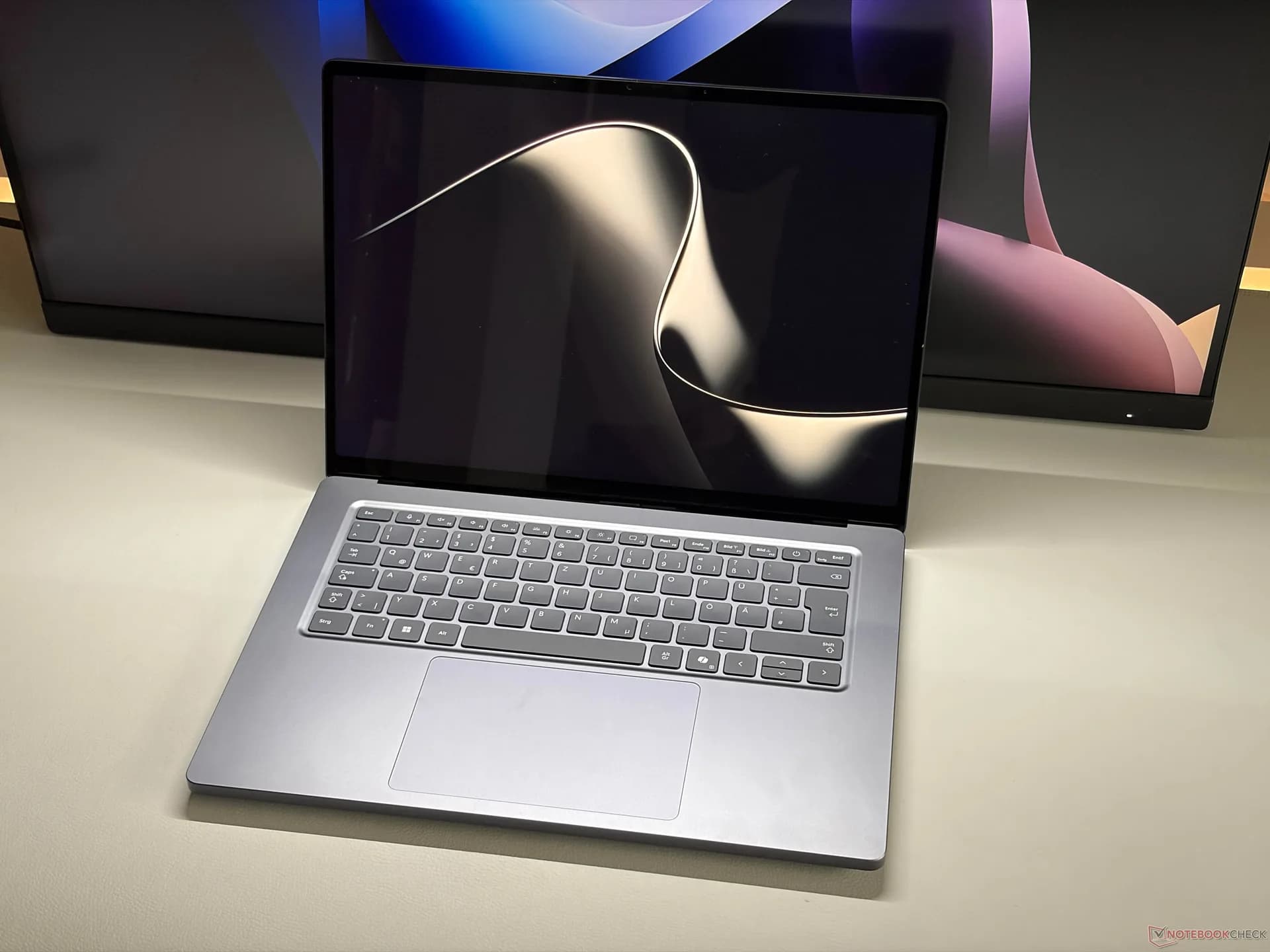 Microsoft Surface Laptop Ultra open on a desk showing its 15-inch Mini-LED display