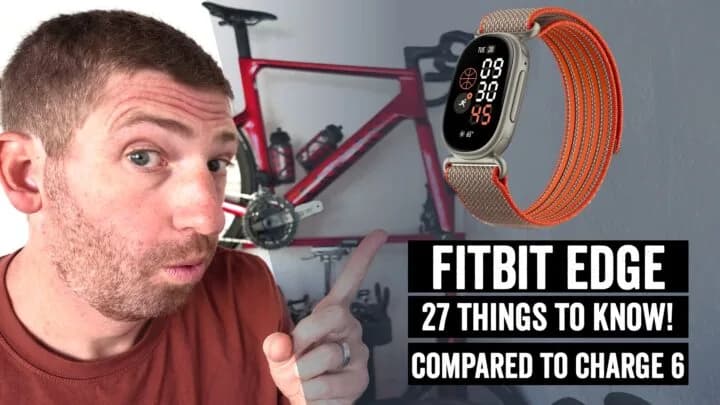 Fitbit Edge fitness tracker on a wrist showing its AMOLED touchscreen and side button, next to its charging cable.