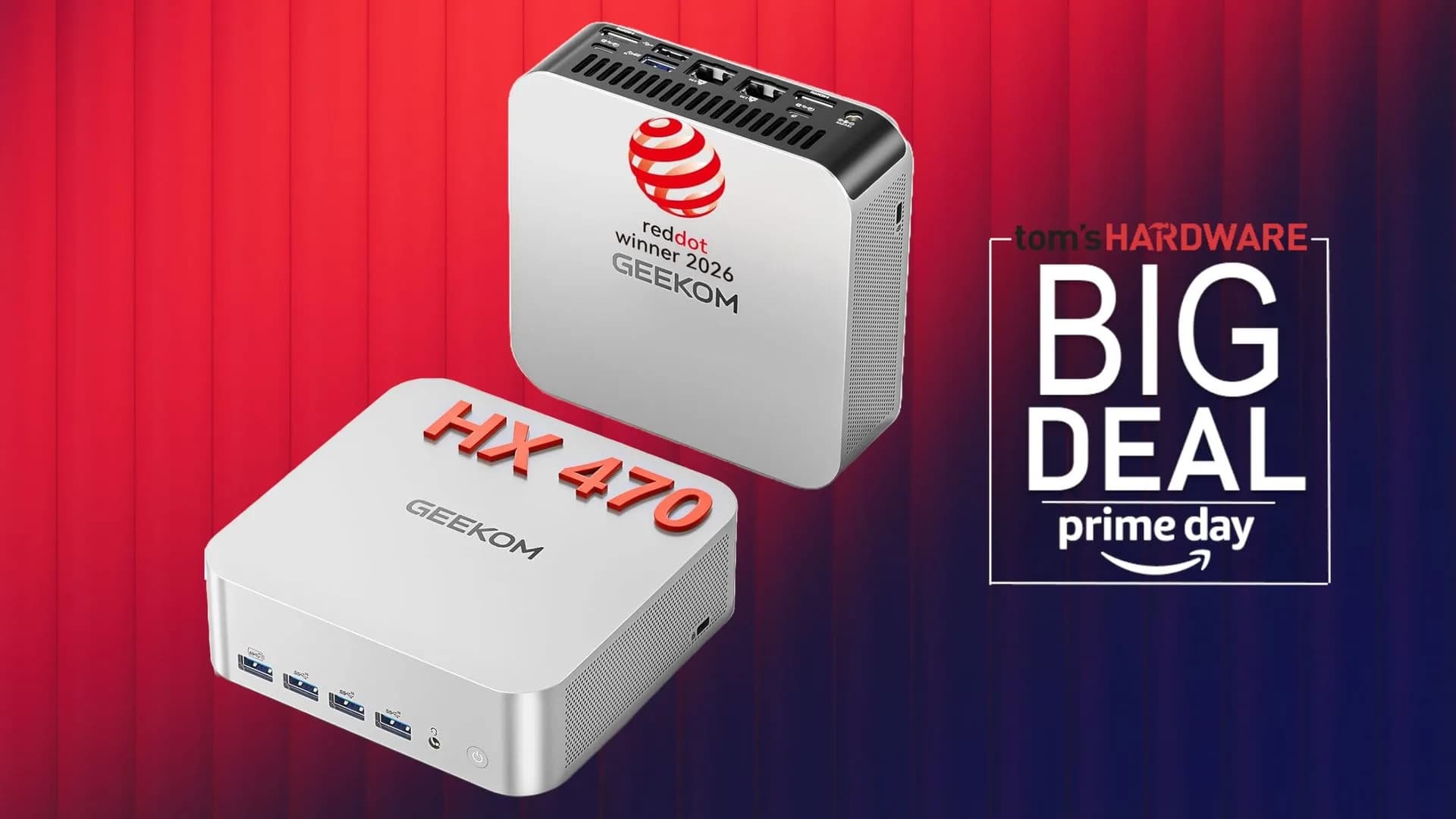 Compact desktop mini PC sitting on a desk next to monitor cables and peripherals.