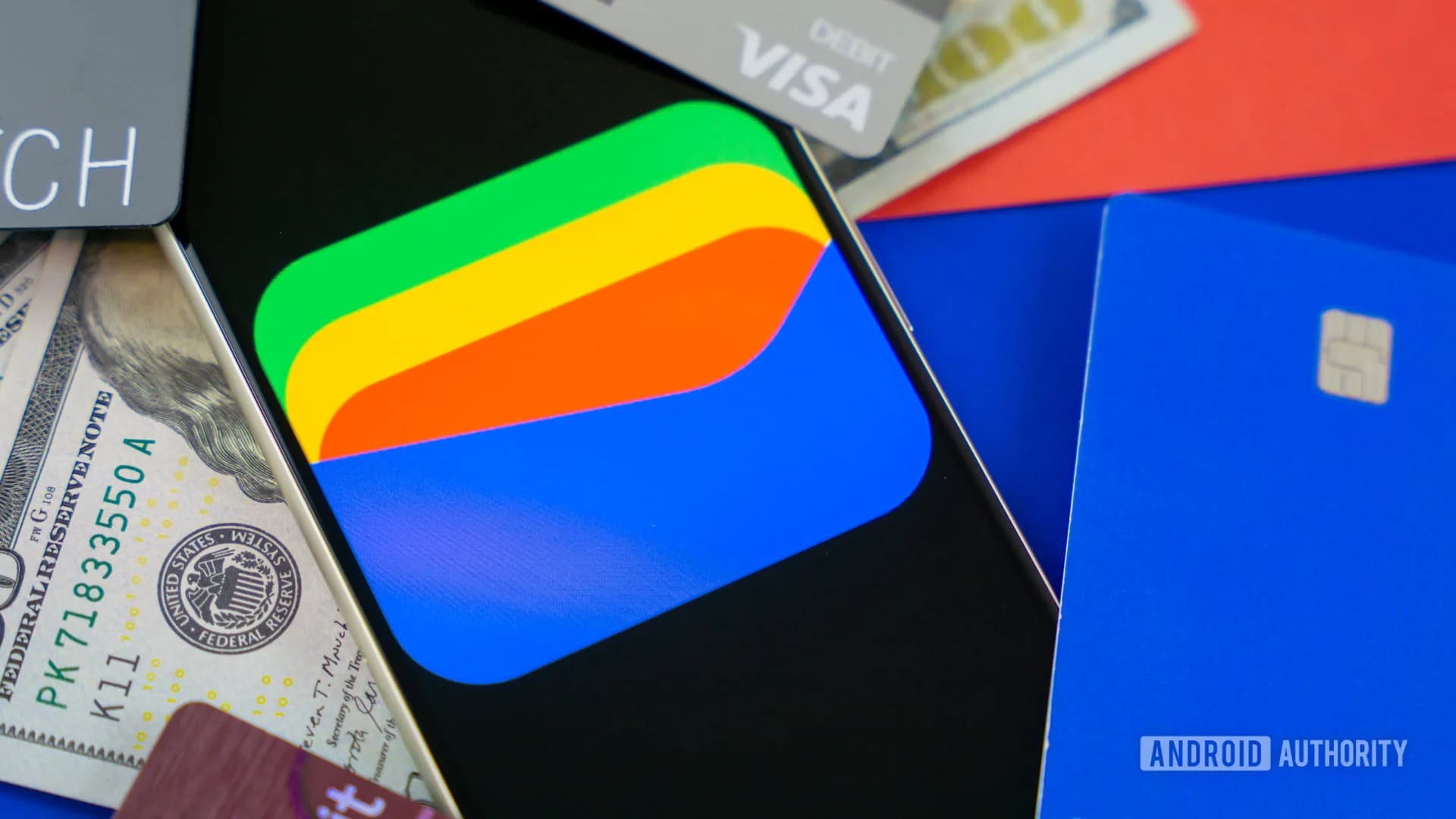 Close up of an Android smartphone displaying digital credit cards inside Google Wallet