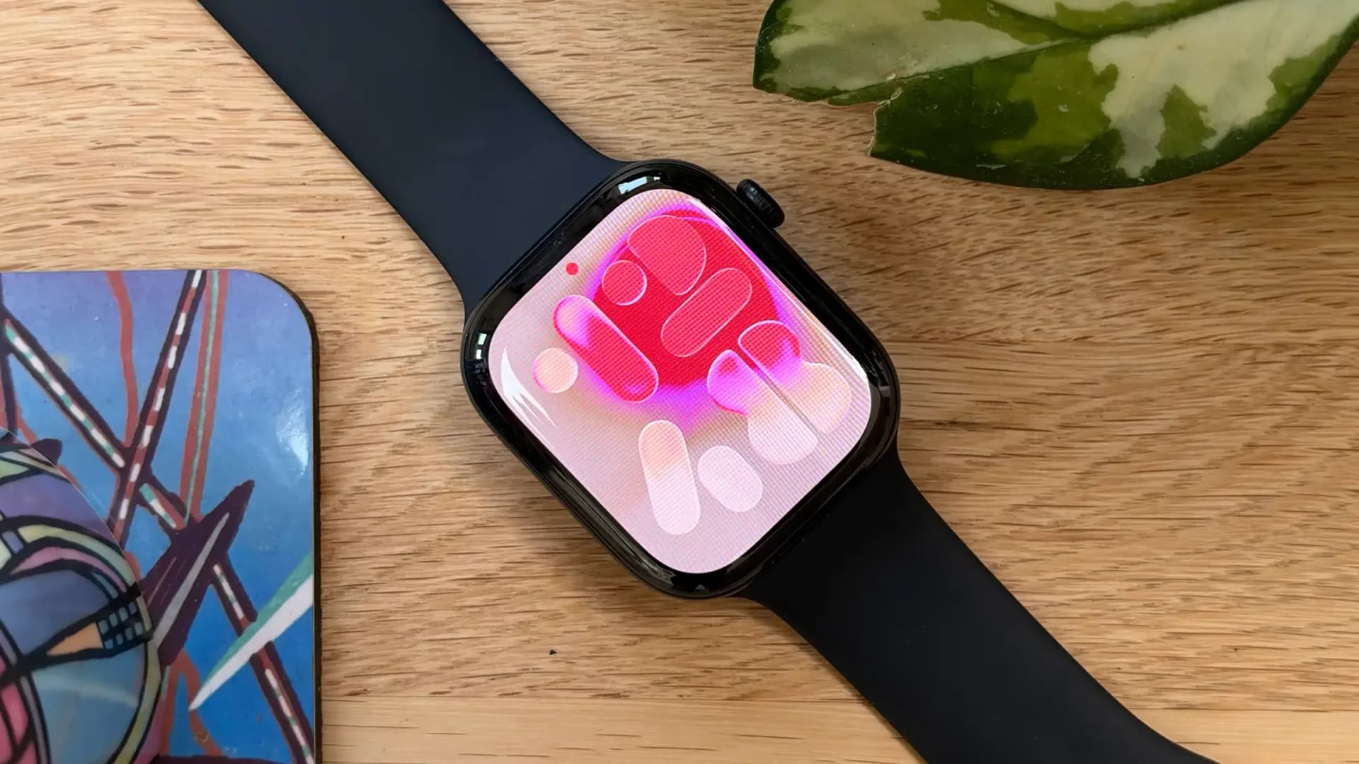 Apple Watch Series 12 on wrist, showing Dark Bronze aluminum case