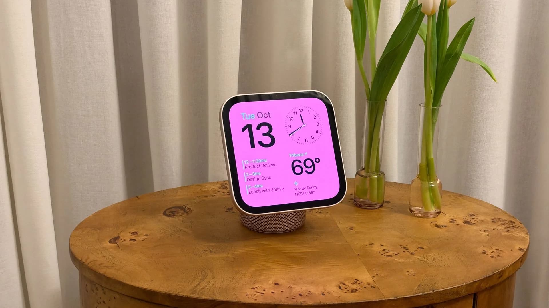Apple HomeView smart display on a kitchen counter, showing a Snoopy-themed watch face with weather and time