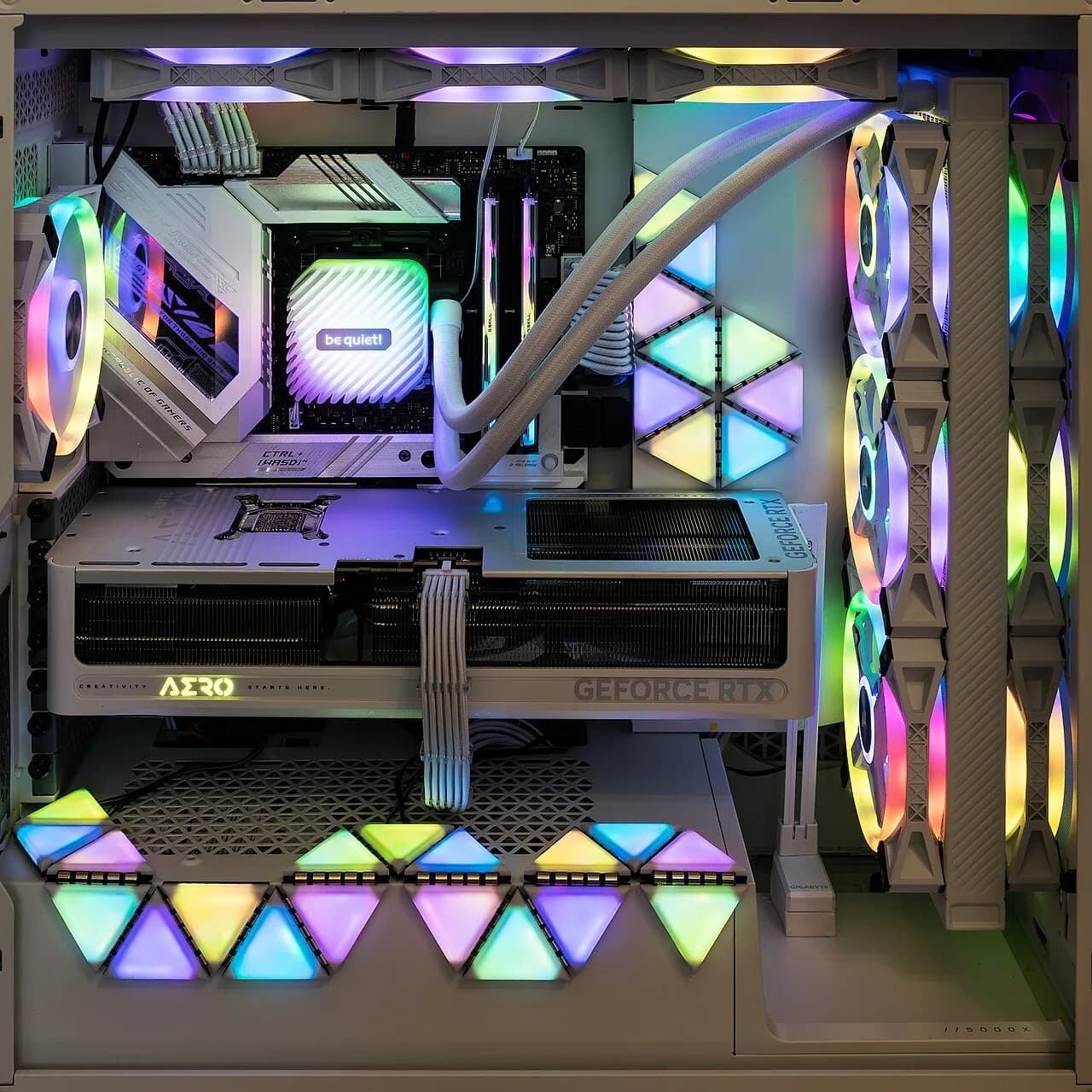Inside a desktop gaming PC with a GeForce RTX graphics card, liquid cooler and RGB fans