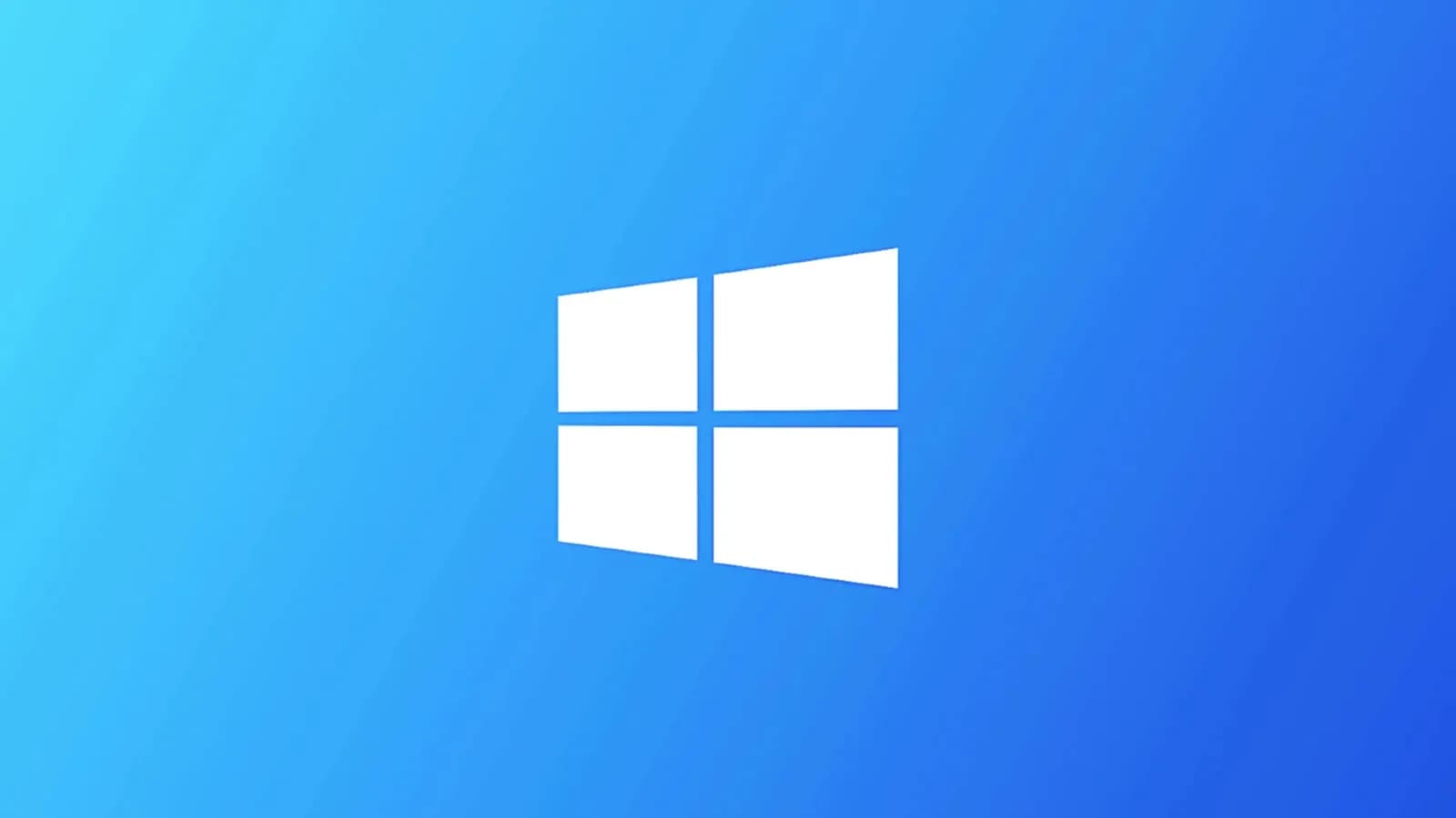 Close up view of a desktop monitor displaying the Windows 10 desktop interface and update settings menu.