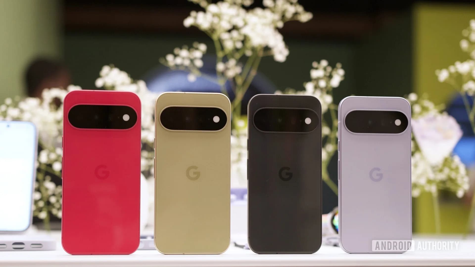 A Google Pixel smartphone resting on a desk with its screen displaying the Android system update settings.