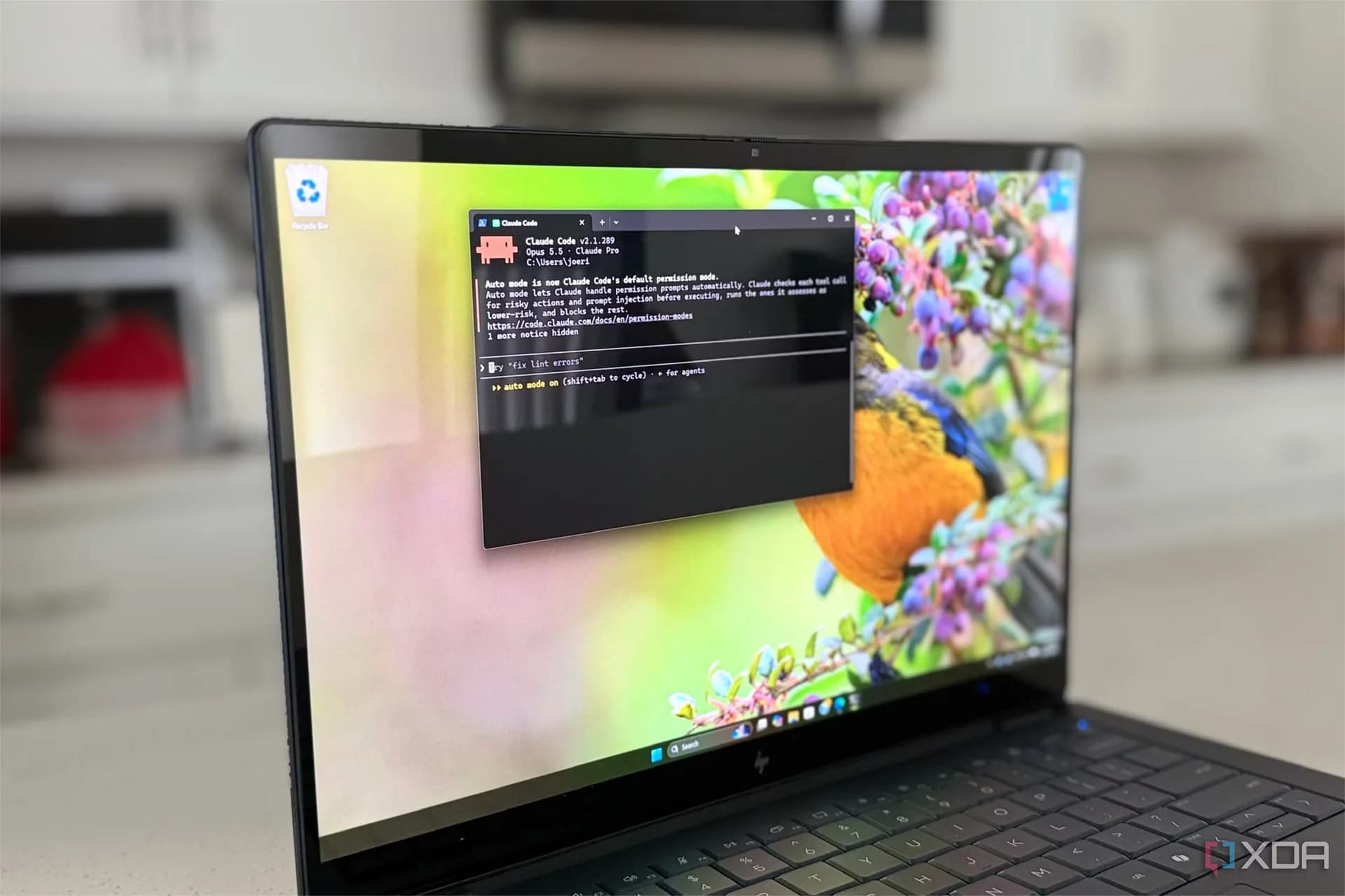 The Claude AI logo displayed on an office computer monitor.