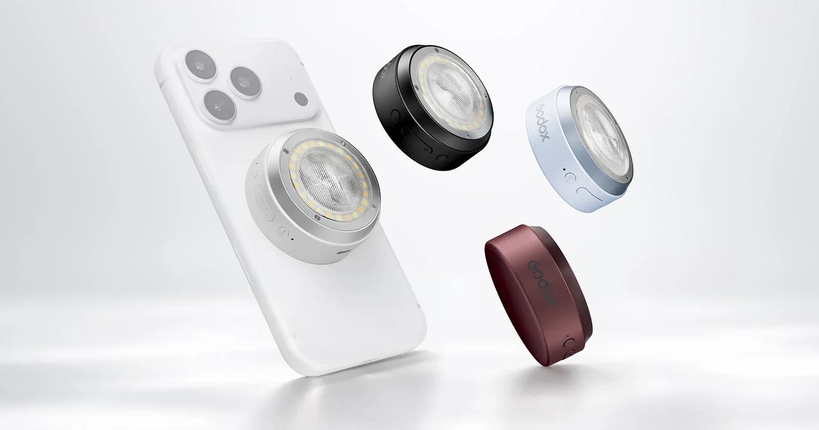 Godox A2 magnetic xenon flash attached to an iPhone via MagSafe, with diffuser mounted