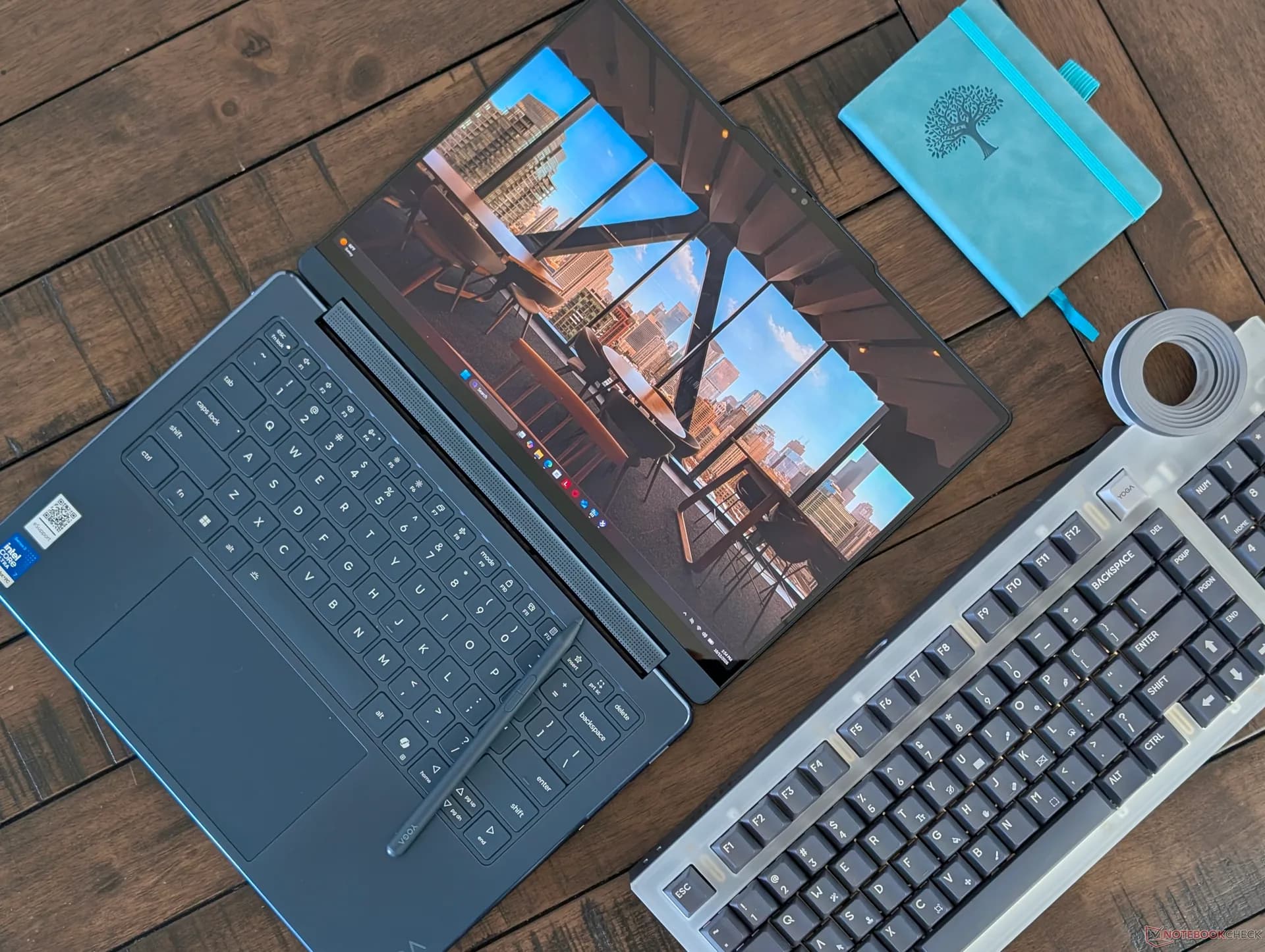 Lenovo Yoga 9 2-in-1 14IPH11 convertible laptop shown open in tablet mode with its stylus
