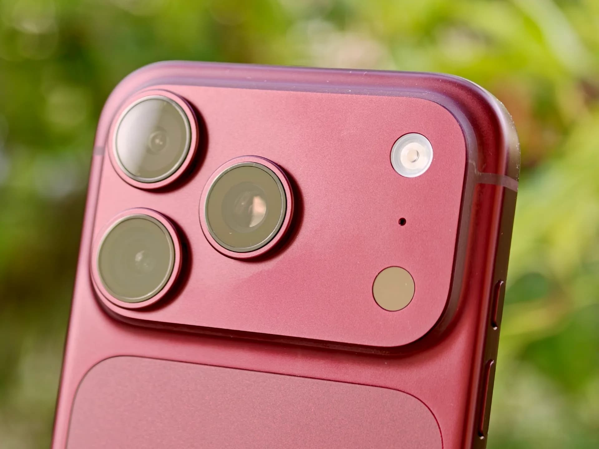 Close-up view of the rear camera lenses on an Apple iPhone Pro smartphone.