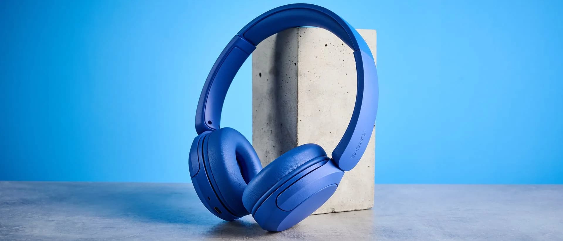 Sony WH-CH530 headphones in Cobalt color, resting on a white surface