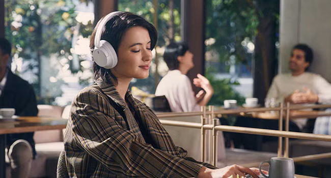 Sony WH-CH720N over-ear wireless headphones resting on a desk