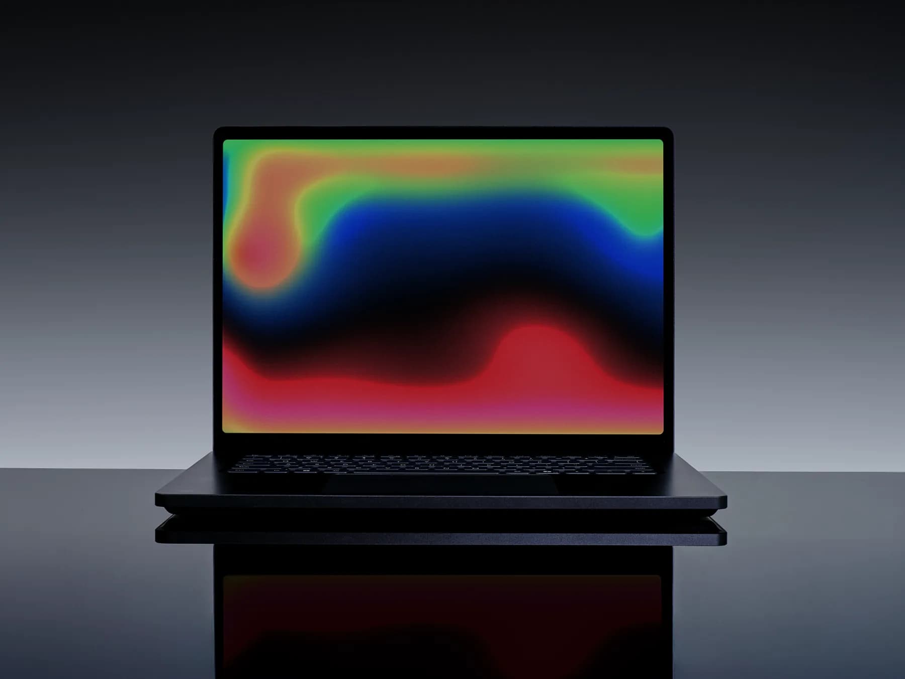 Microsoft Surface Laptop Ultra open on a desk showing Windows 11 and Copilot AI agent interfaces.