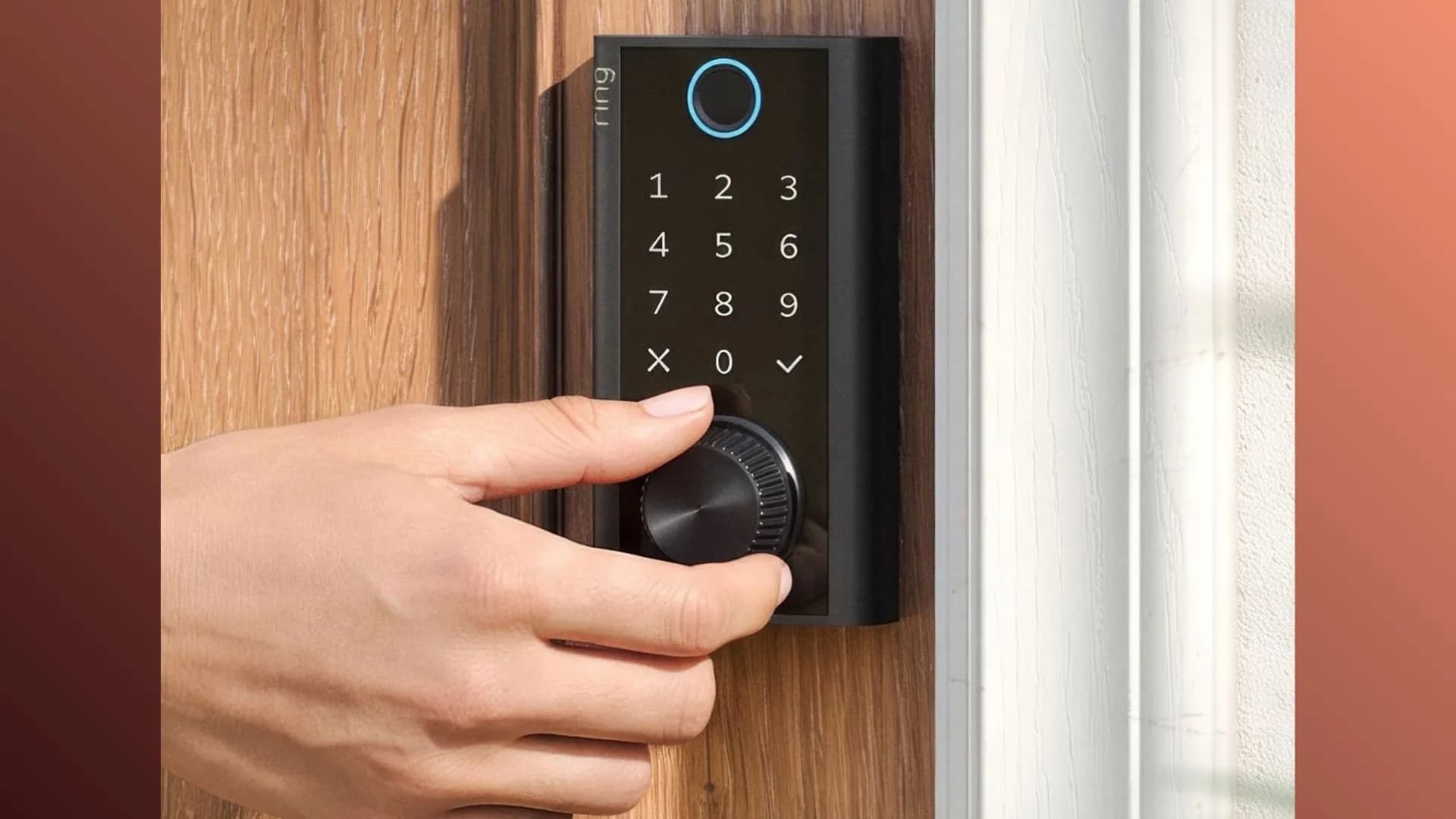 A modern smart door lock mechanism mounted on a wooden door front.