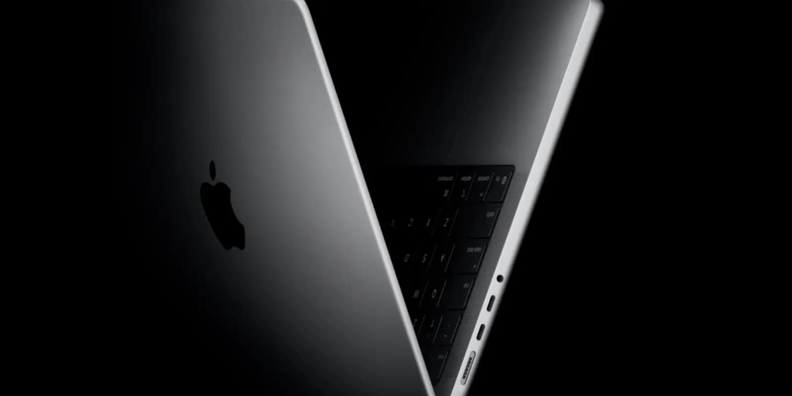 A mockup showing a MacBook Pro with a glowing OLED display and subtle touch interface elements