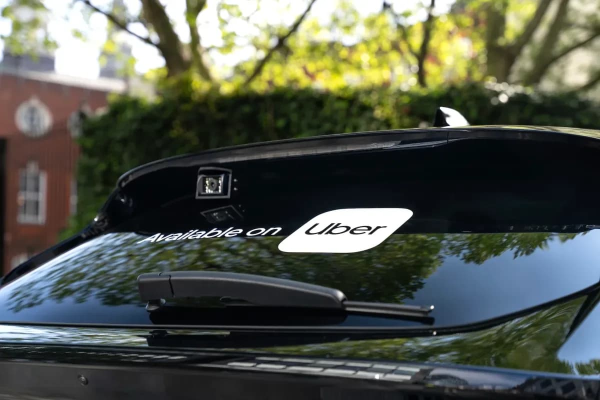 Uber app and ChatGPT logos displayed together on a smartphone screen