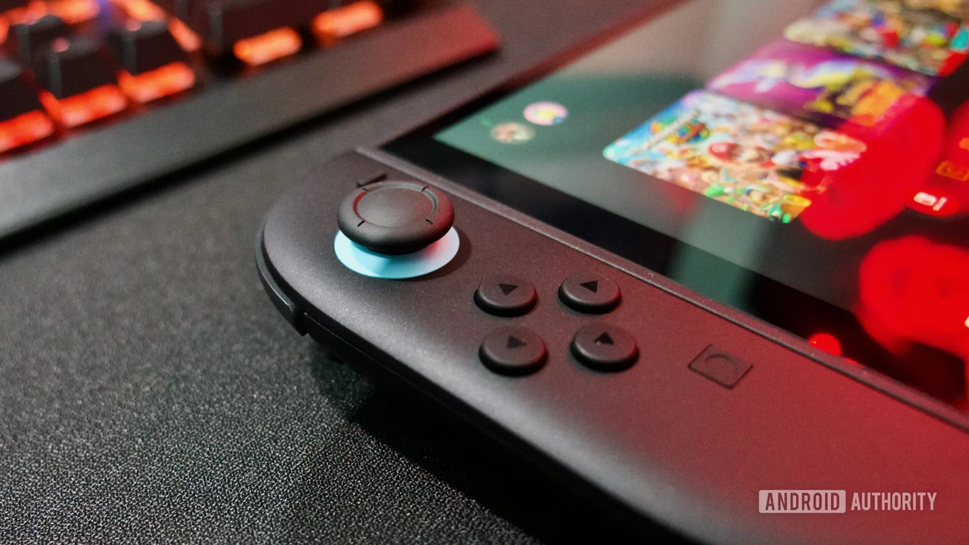 A Nintendo Switch 2 console displaying a YouTube video interface on its screen