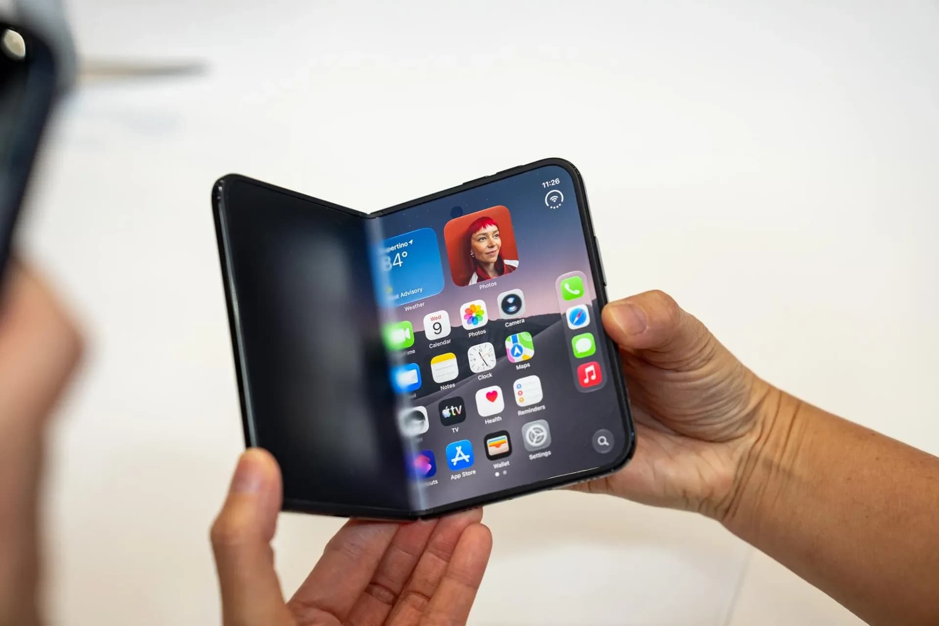 iPhone Duo folded and unfolded, front-facing, showing outer screen and inner matte display