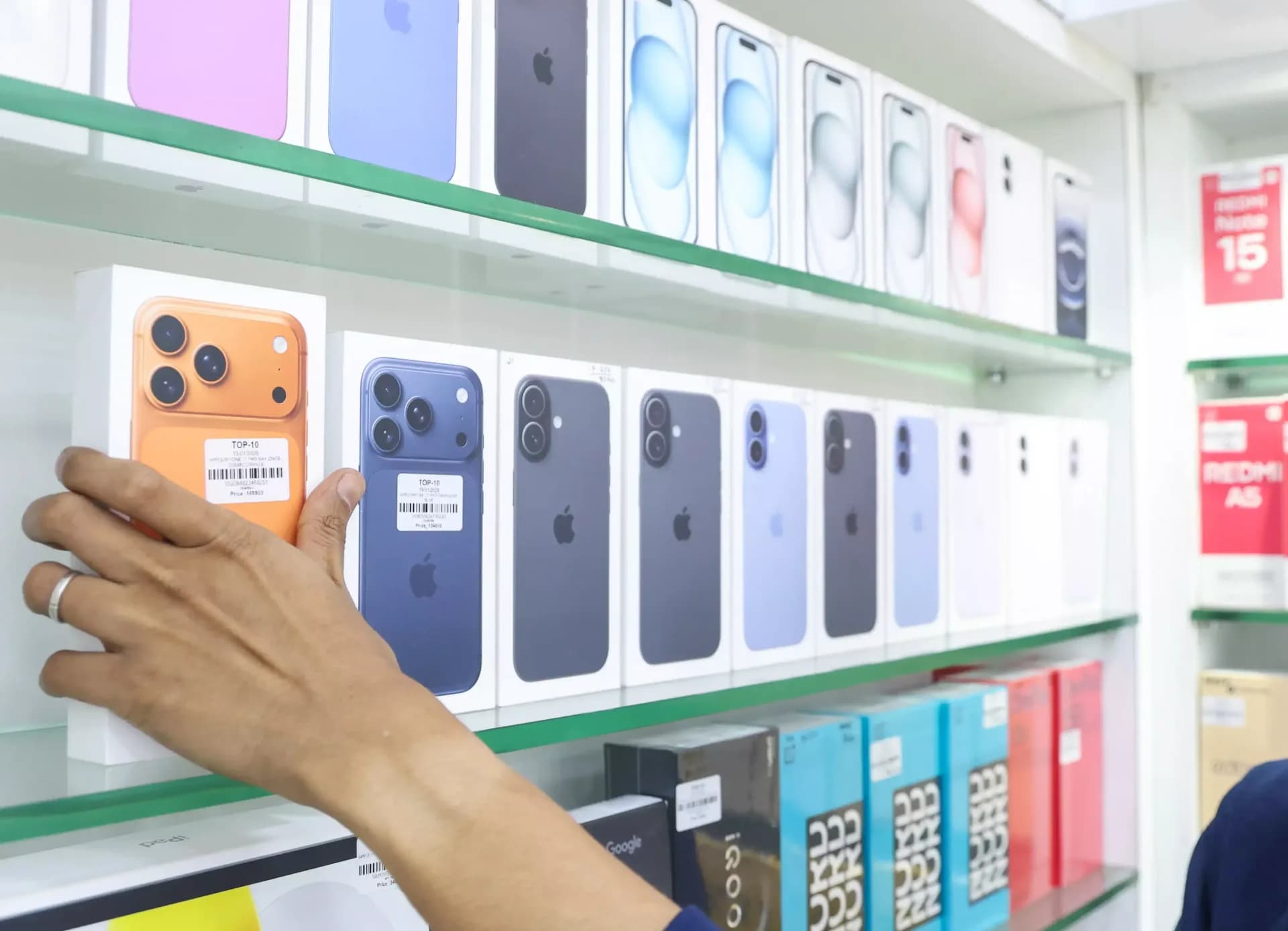 Smartphones arranged on display inside a retail electronics showroom in India during the festive shopping season.
