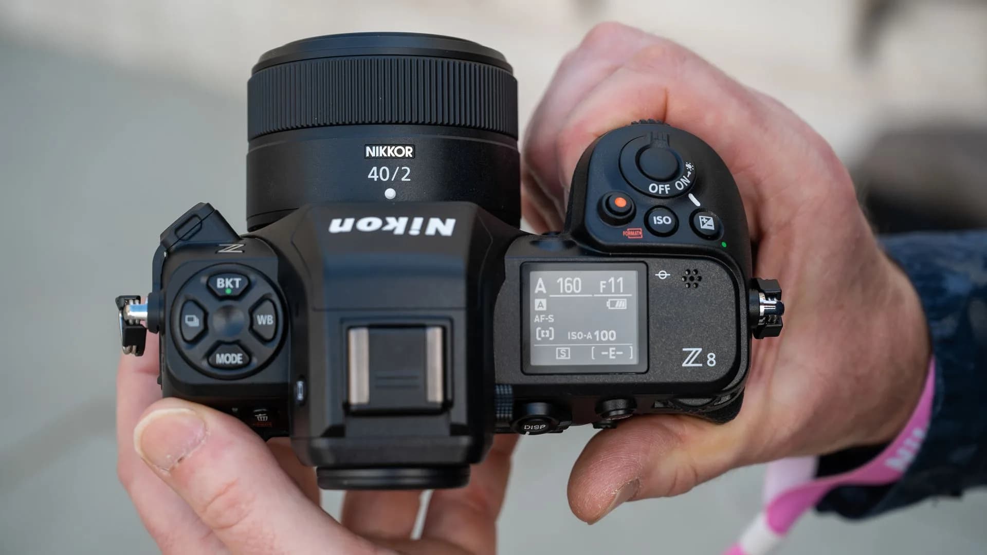 A Nikon D850 DSLR camera body shown with a lens attached against a plain background