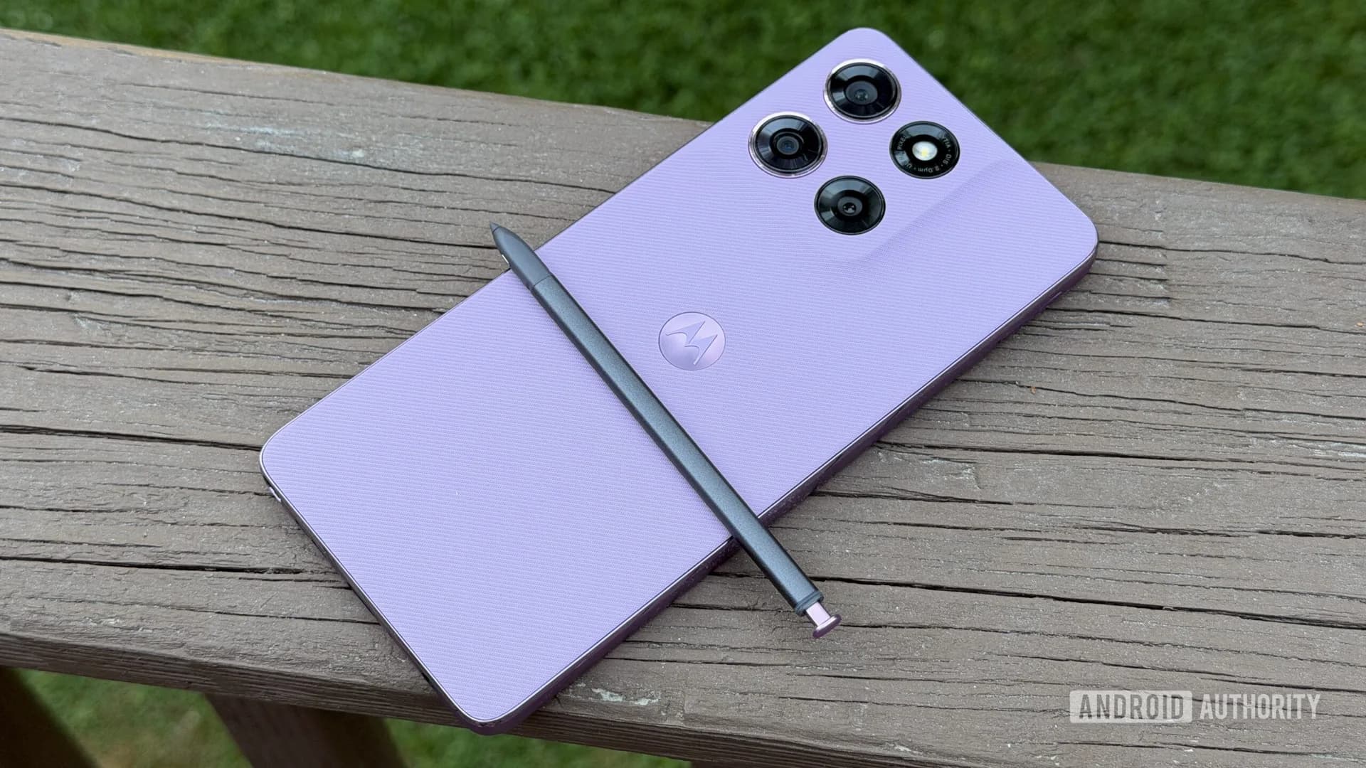 LG B6 OLED TV and Moto G Stylus (2026) side by side on a living room shelf