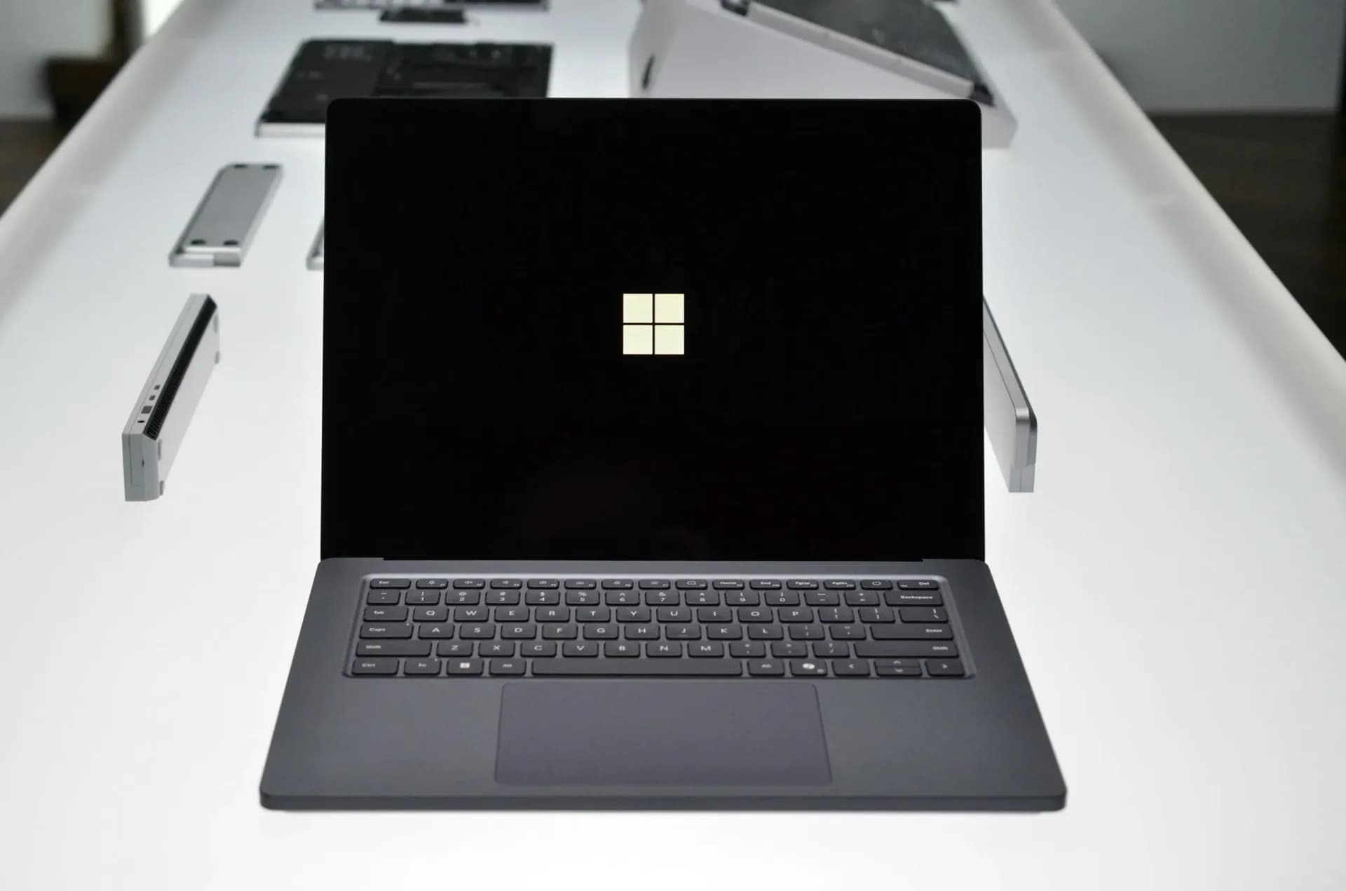 Asus ProArt P16 RTX Spark laptop shown open on a studio desk with stylus and color calibration tool