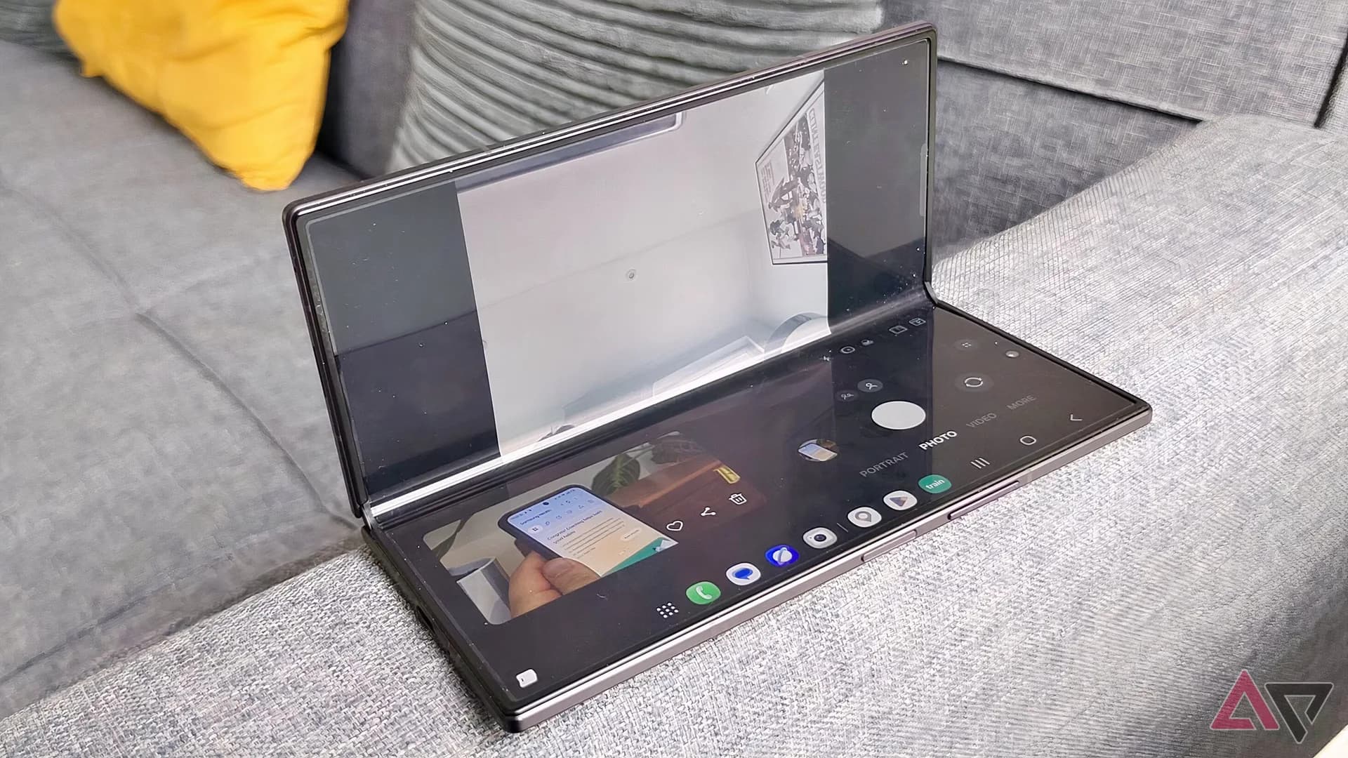 Samsung Galaxy Z Fold 8 shown partially open displaying its cover and inner AMOLED screens