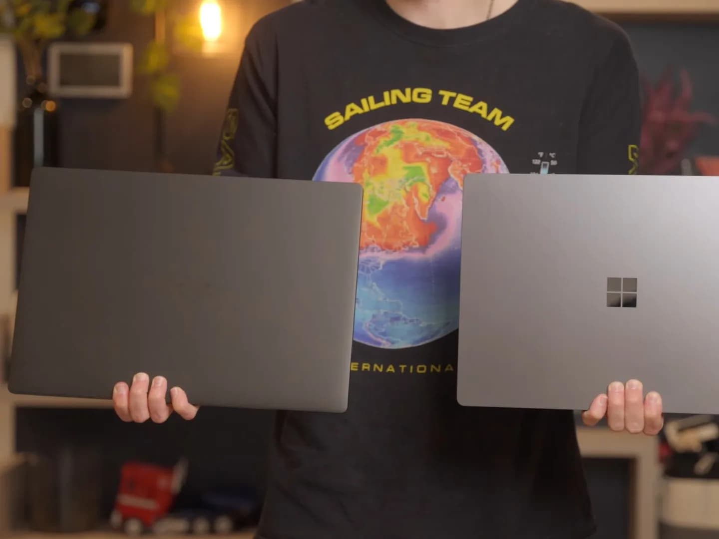 Microsoft Surface Laptop Ultra next to MacBook Pro 14 and Asus Zenbook A16, all closed, on a desk