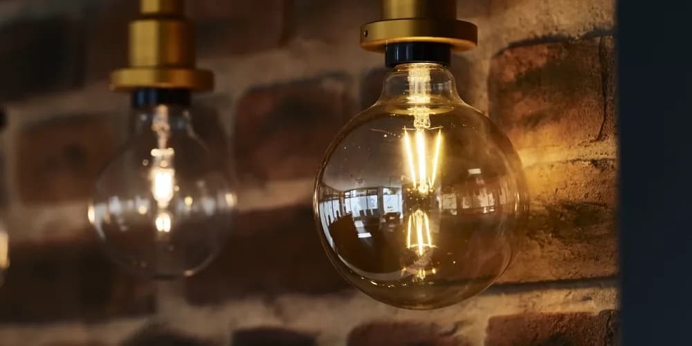 Smart LED light bulbs and ambient fixtures glowing against a clean interior backdrop