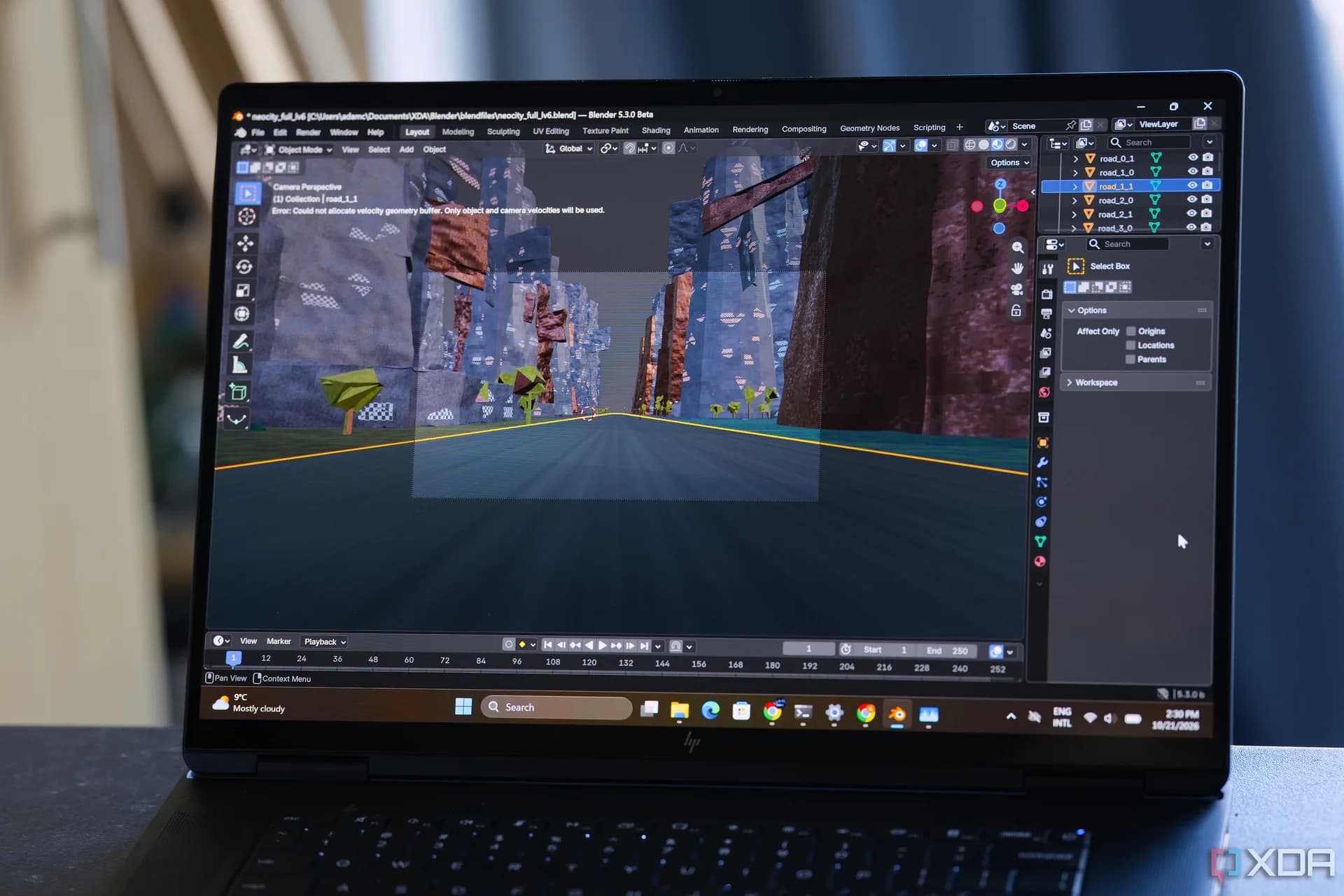 HP OmniBook Ultra 16 laptop with Nvidia RTX Spark hardware rendering a procedurally generated city scene in Blender