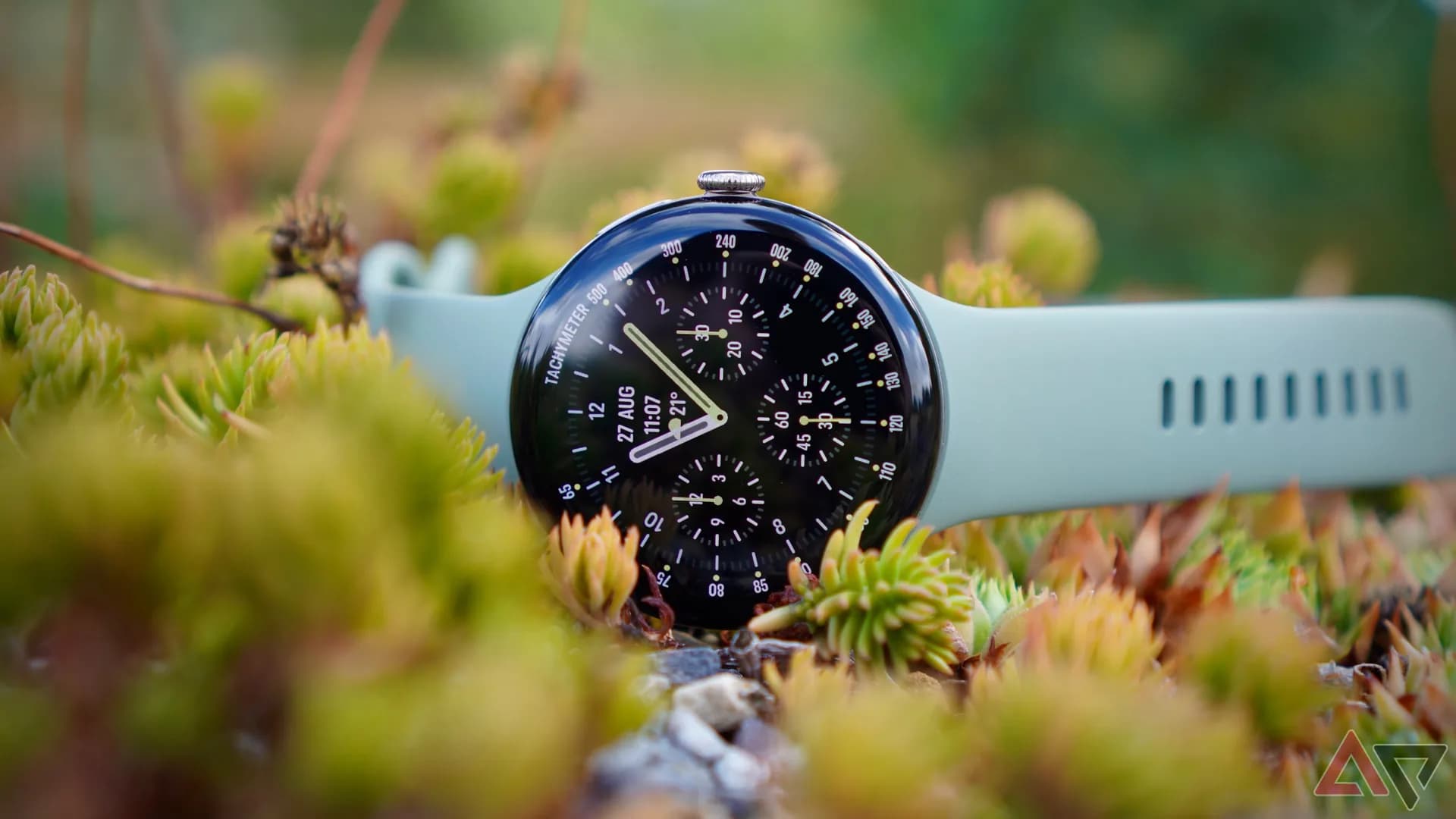 A Pixel Watch on a wrist showing a low battery percentage on its display