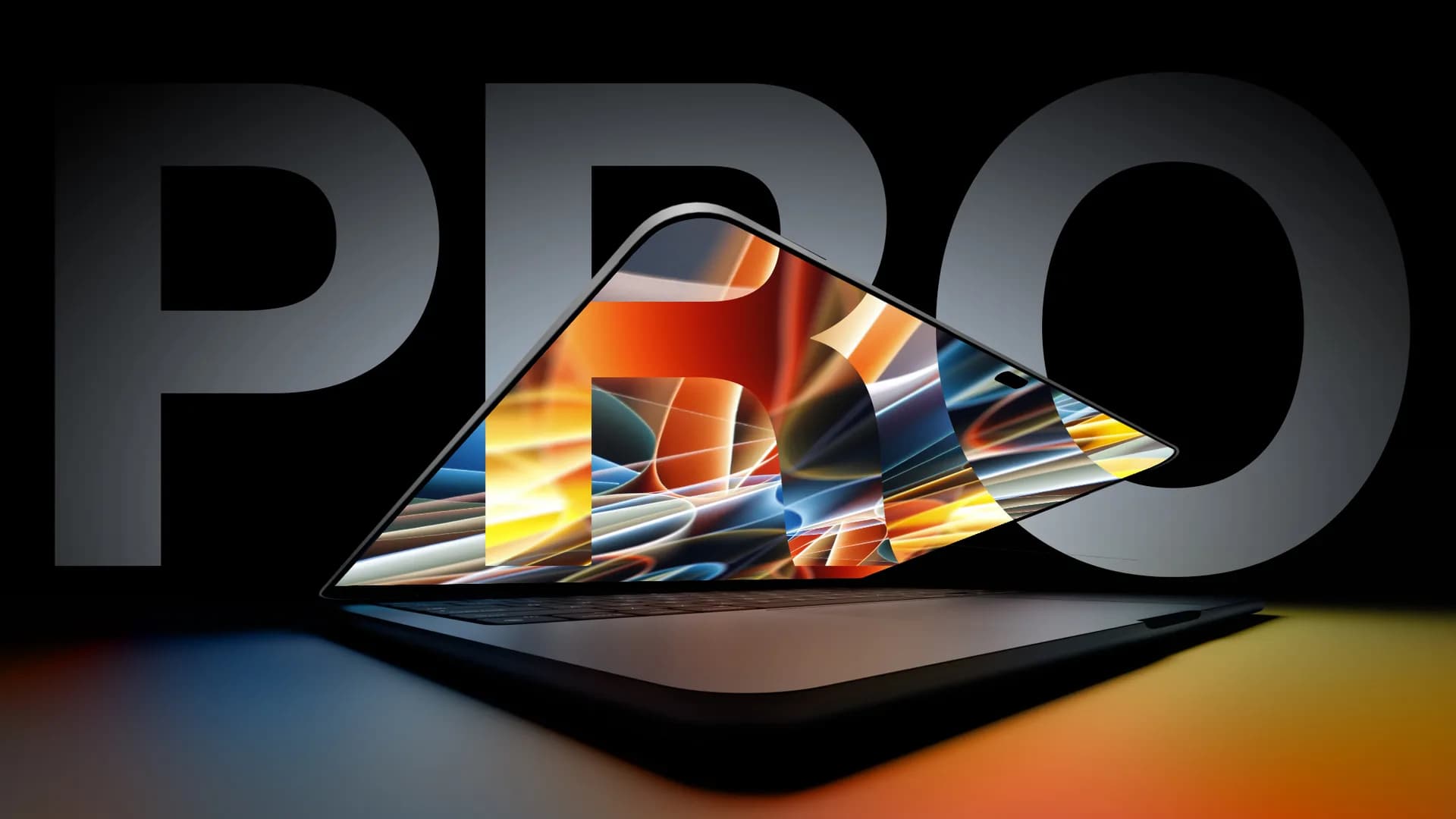 Apple logo displayed on an aluminum laptop lid beside an illuminated display