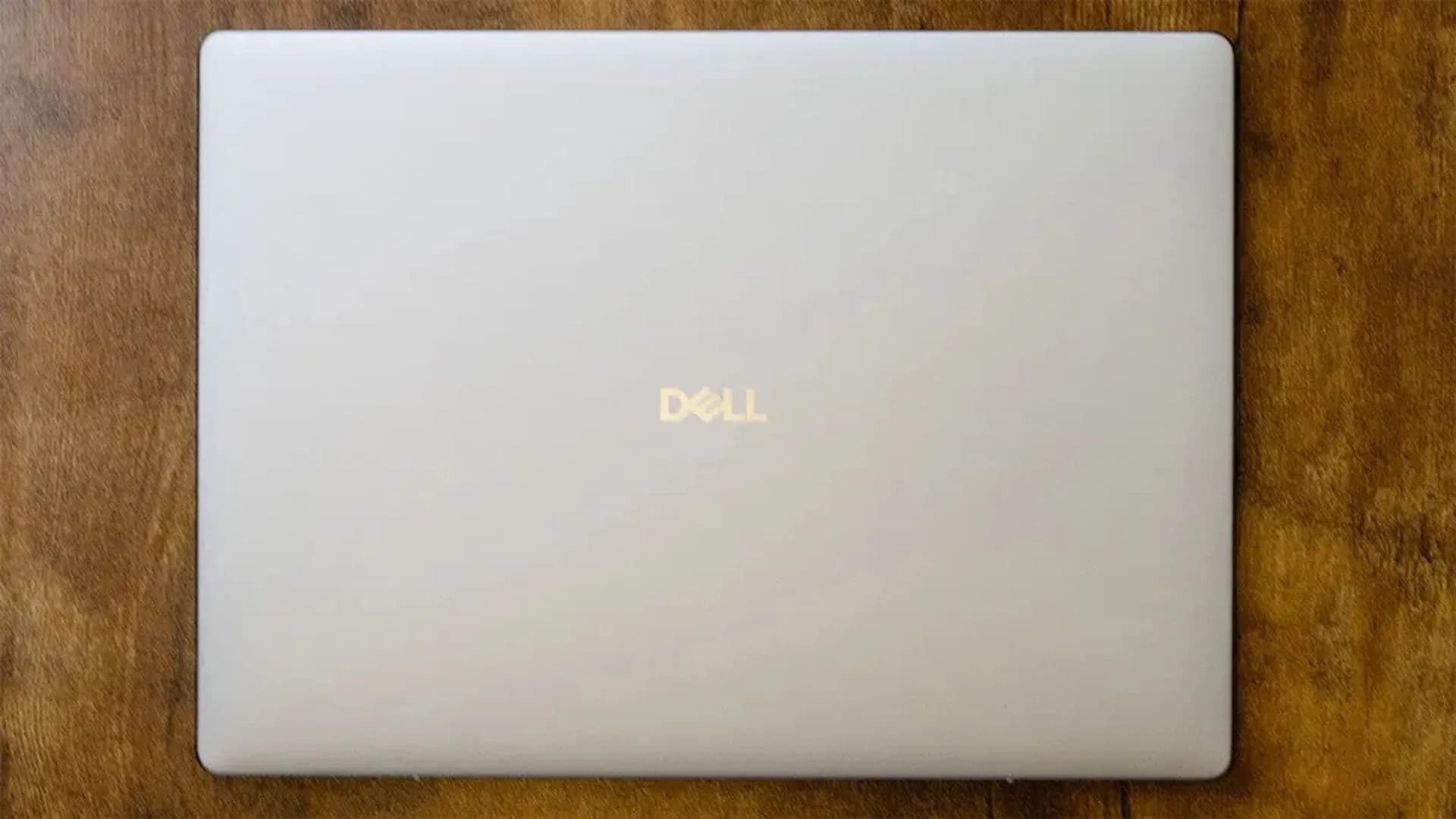 Three Dell laptops, the Dell 15, Dell 16 and Dell 14 Plus, shown side by side with their screens open.