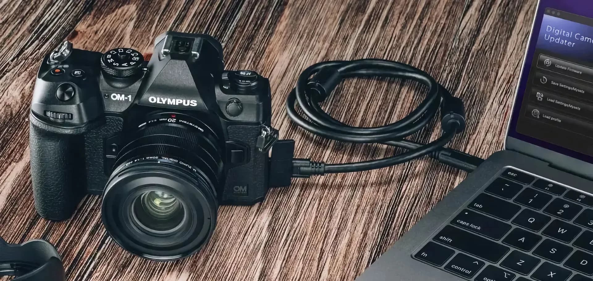 OM System telephoto zoom lens mounted on a digital camera body