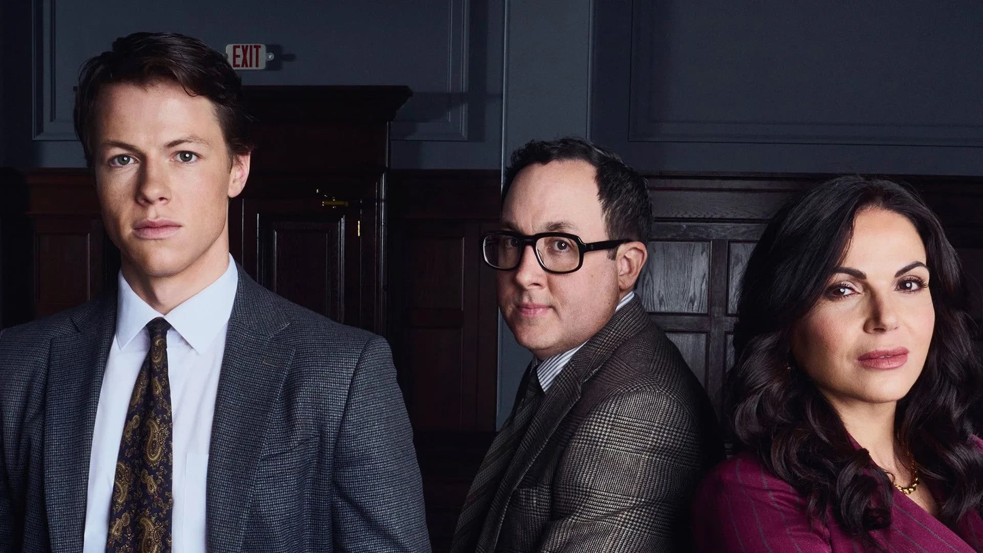 A promotional still from The Rainmaker Season 2 featuring Milo Callaghan as Rudy Baylor in a courtroom setting.