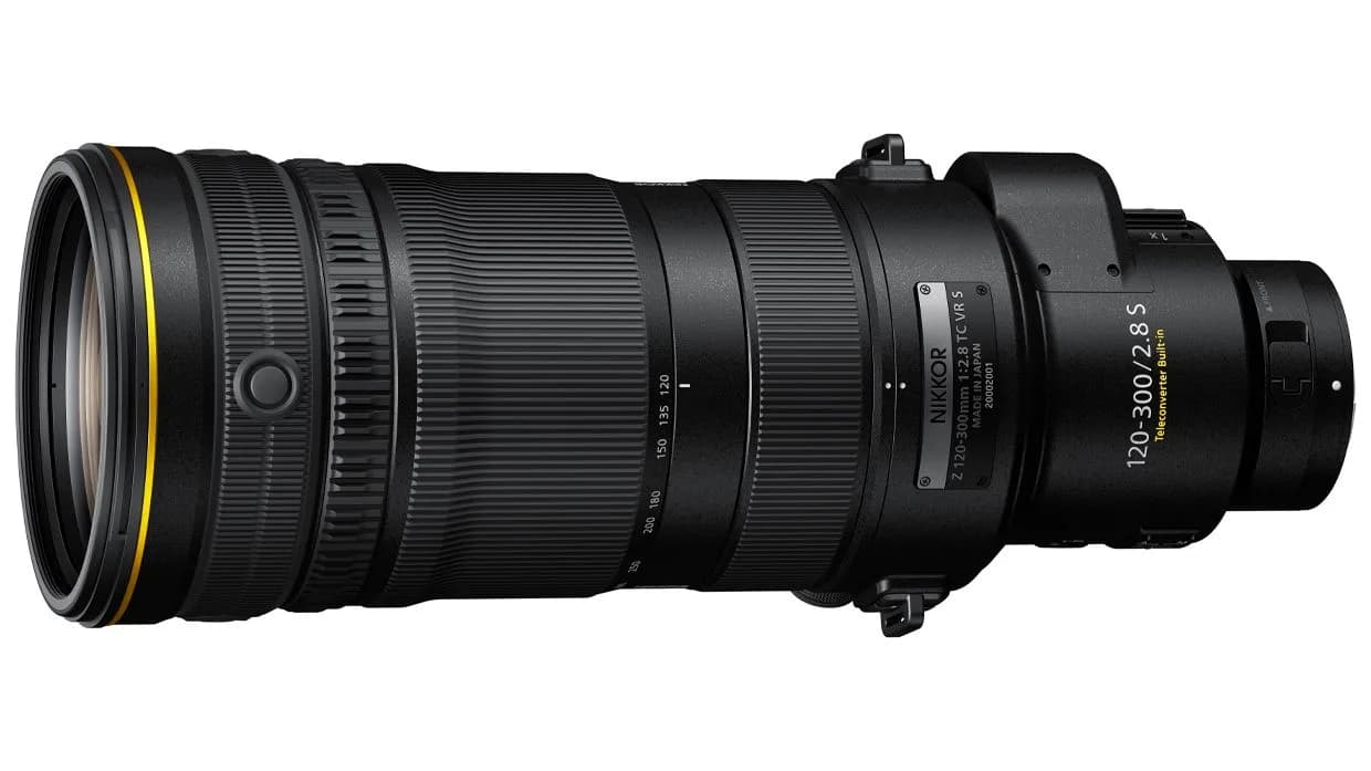 Close-up of a professional Nikon camera telephoto lens with a lens hood attached