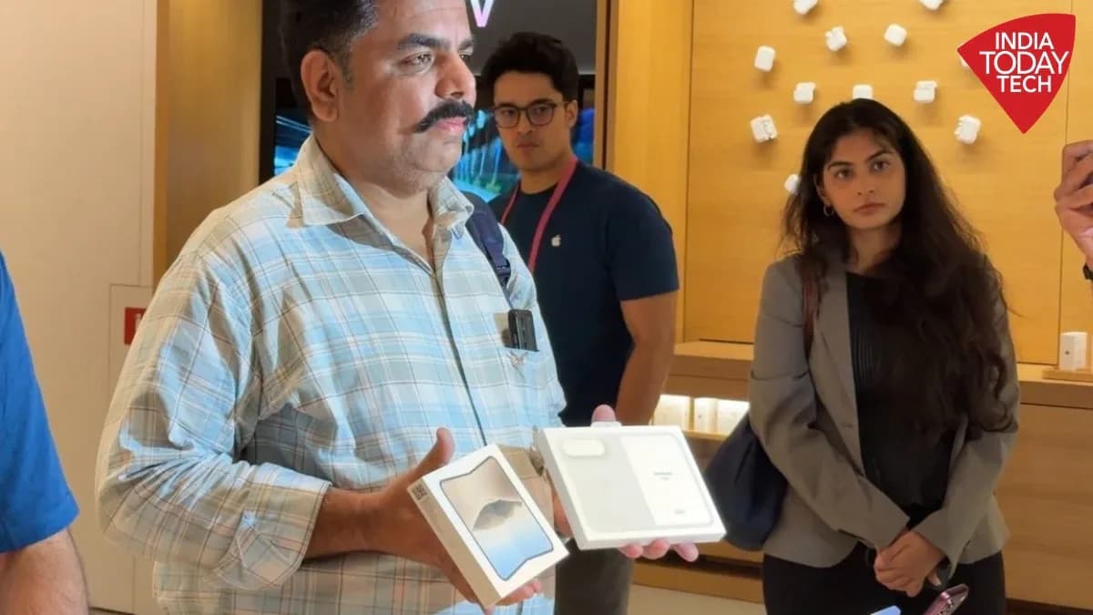 Empty chairs set up outside an Apple Store in Delhi for the iPhone Duo launch, with only a few customers present.