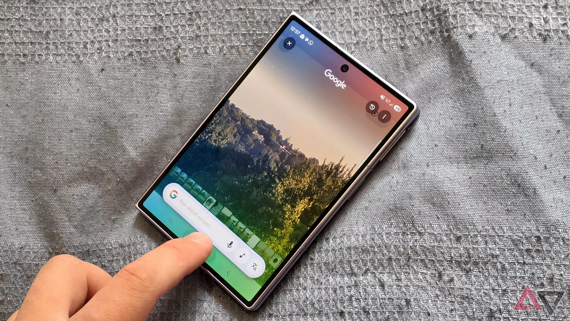 Samsung Galaxy Z Fold 8 unfolded halfway on a wooden surface showing its inner screen