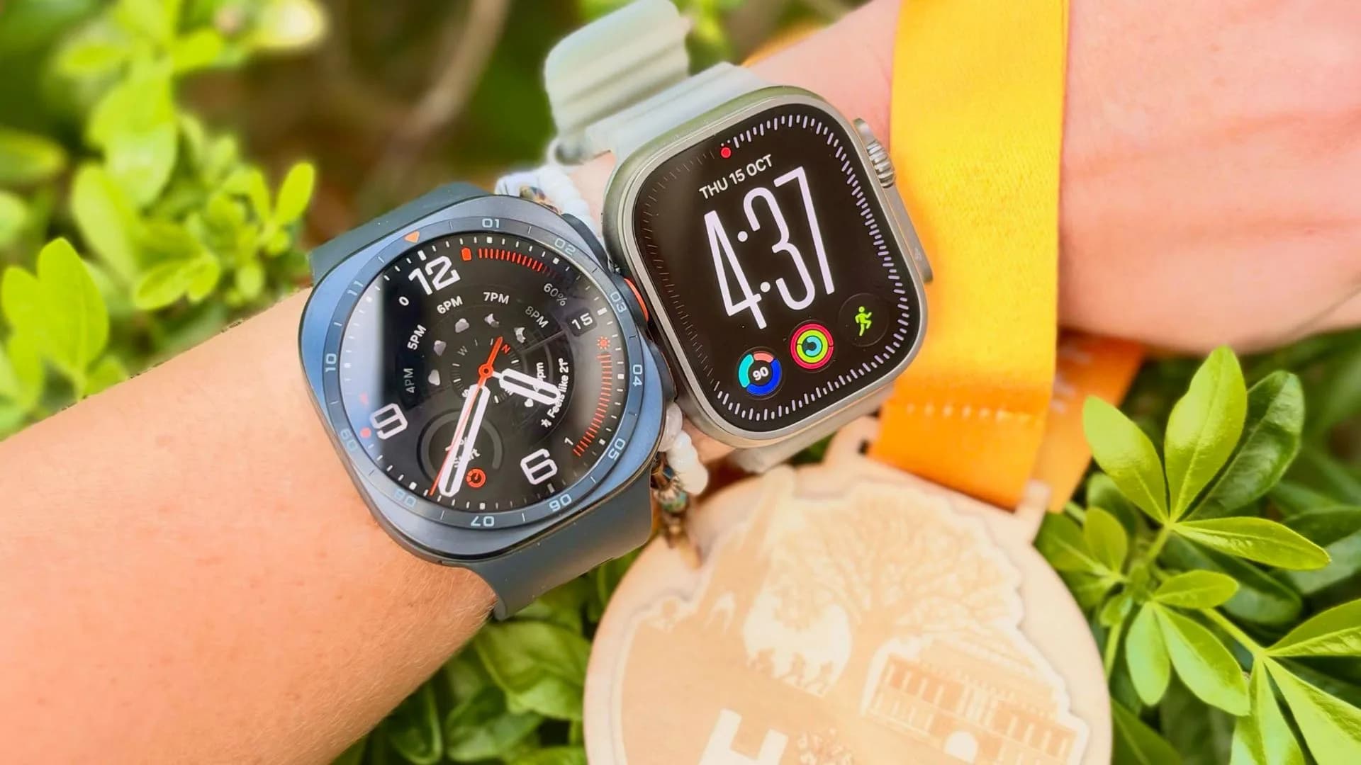 Apple Watch Ultra 4 and Samsung Galaxy Watch Ultra 2 worn side by side on a runner's wrist