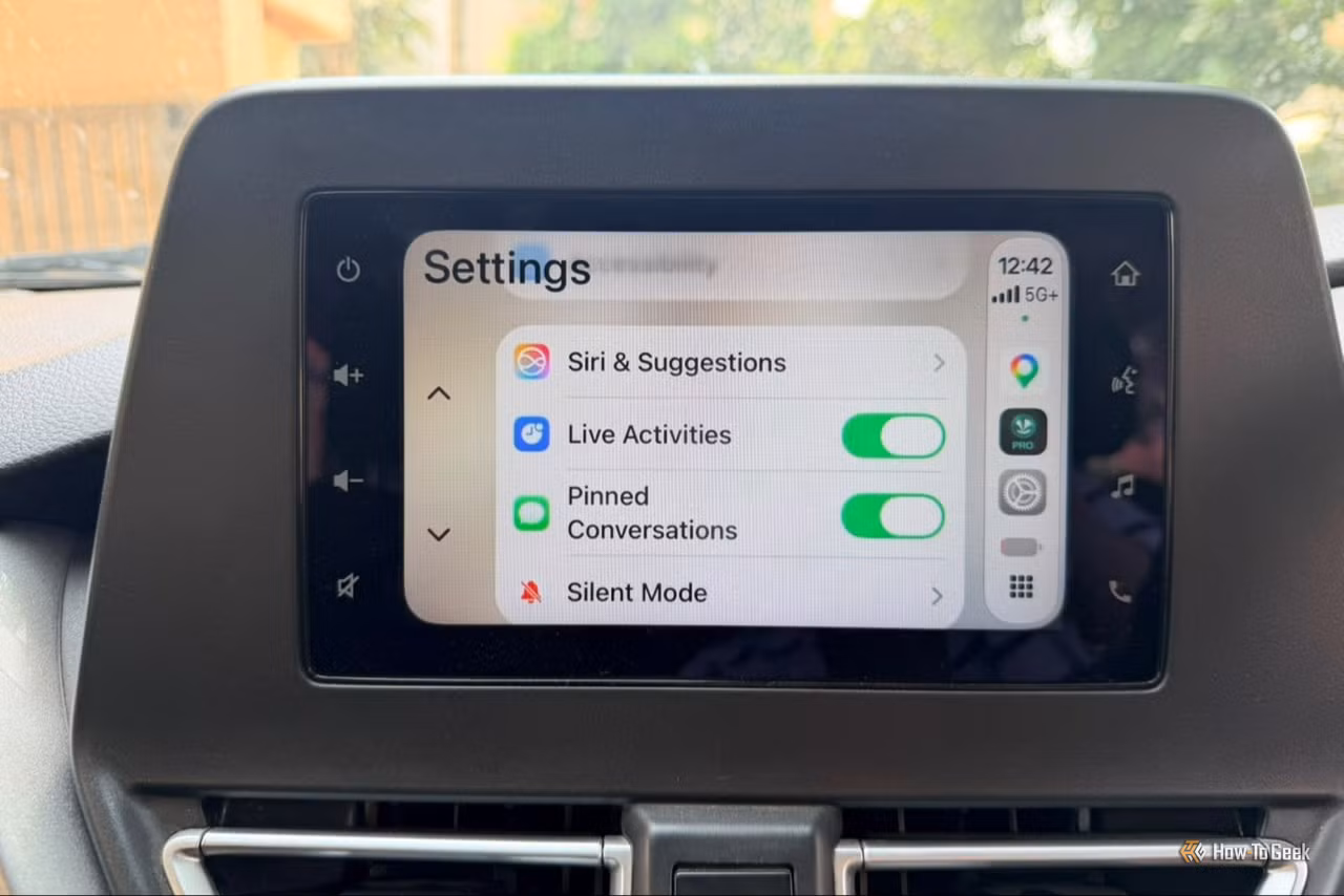 Split-screen comparison showing Android Auto interface on left and Apple CarPlay interface on right, both displayed on a car infotainment screen.