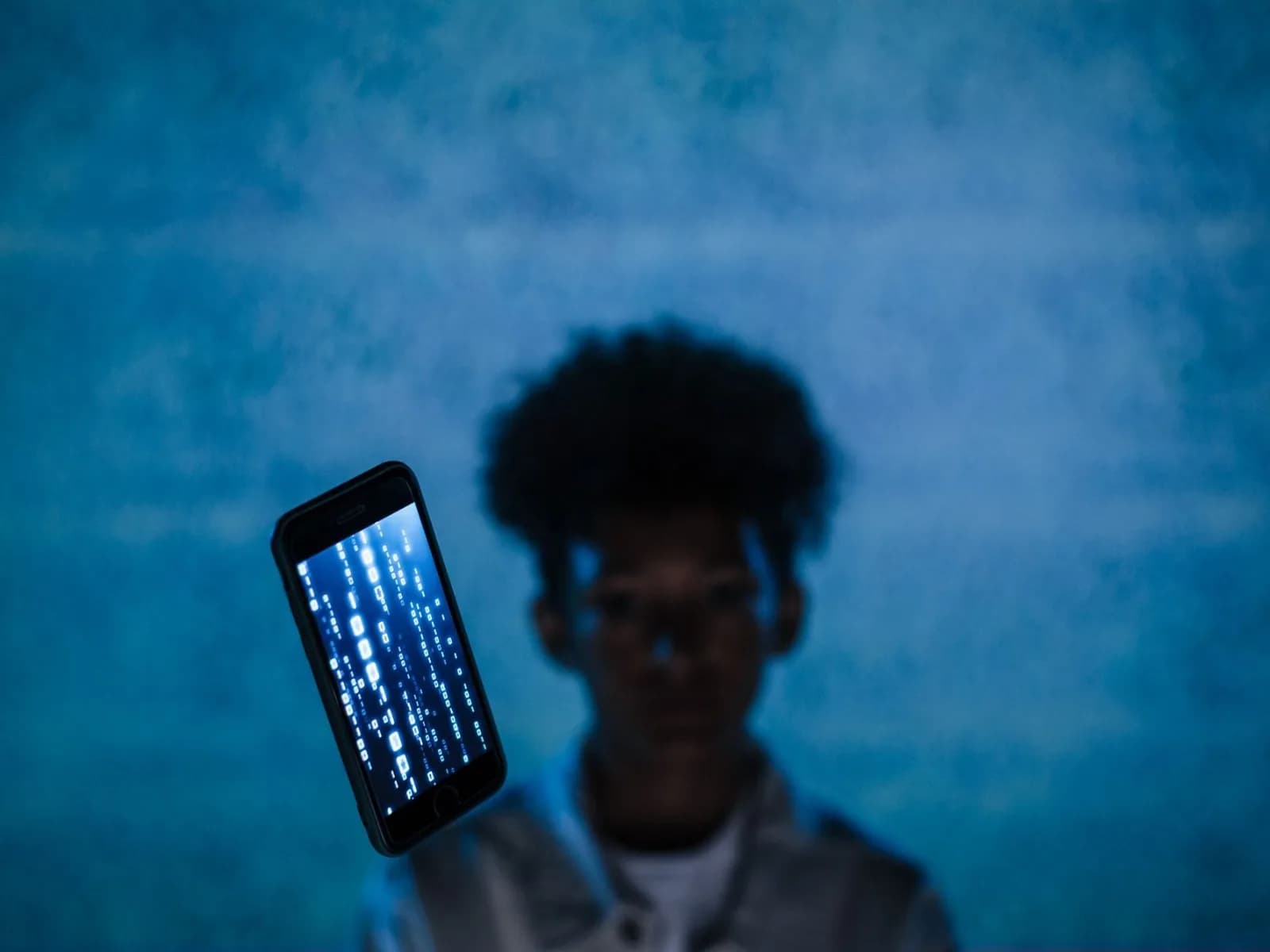 A smartphone running the Google Messages app displaying an incoming text message from an unknown number.