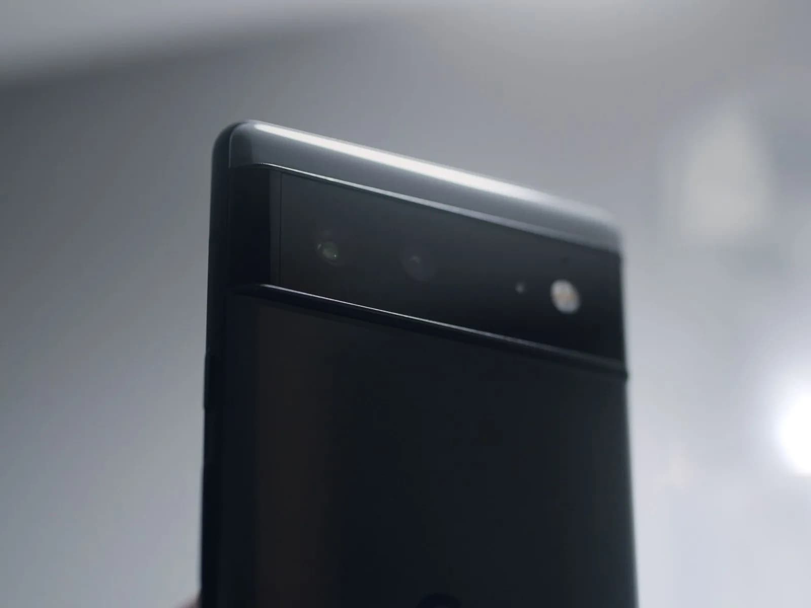 Google Pixel 6 and Pixel 6 Pro smartphones resting on a table