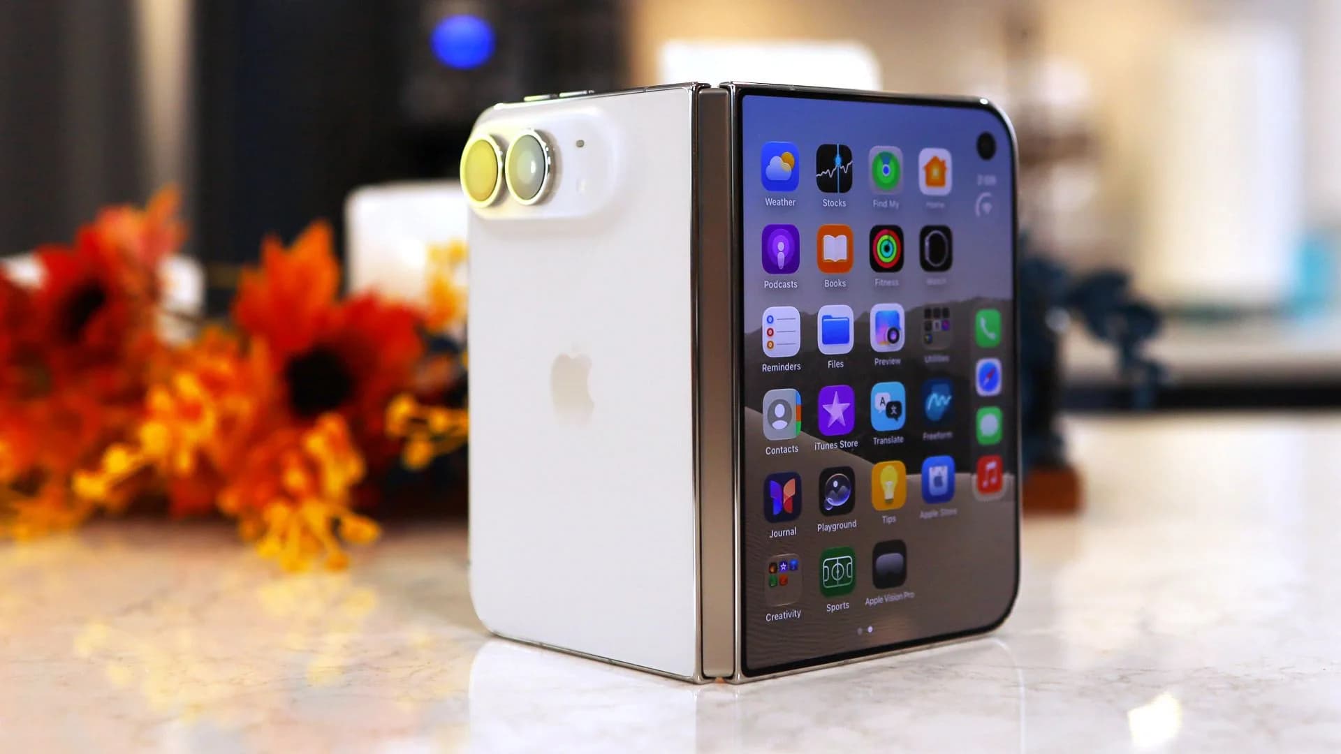 An iPhone Duo folded open showing its inner display and hinge area.