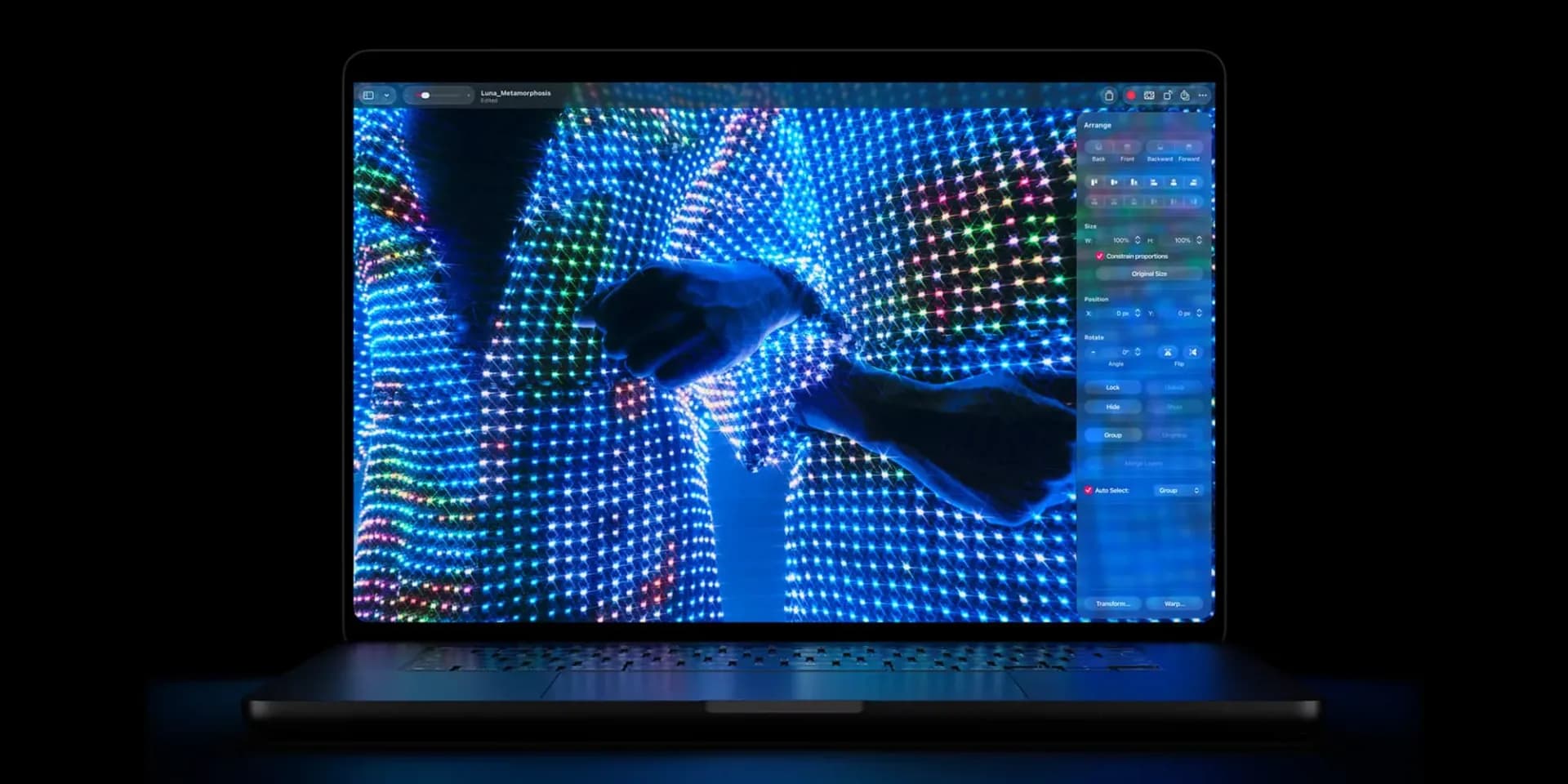 Apple MacBook Pro laptop displaying a bright OLED touchscreen interface