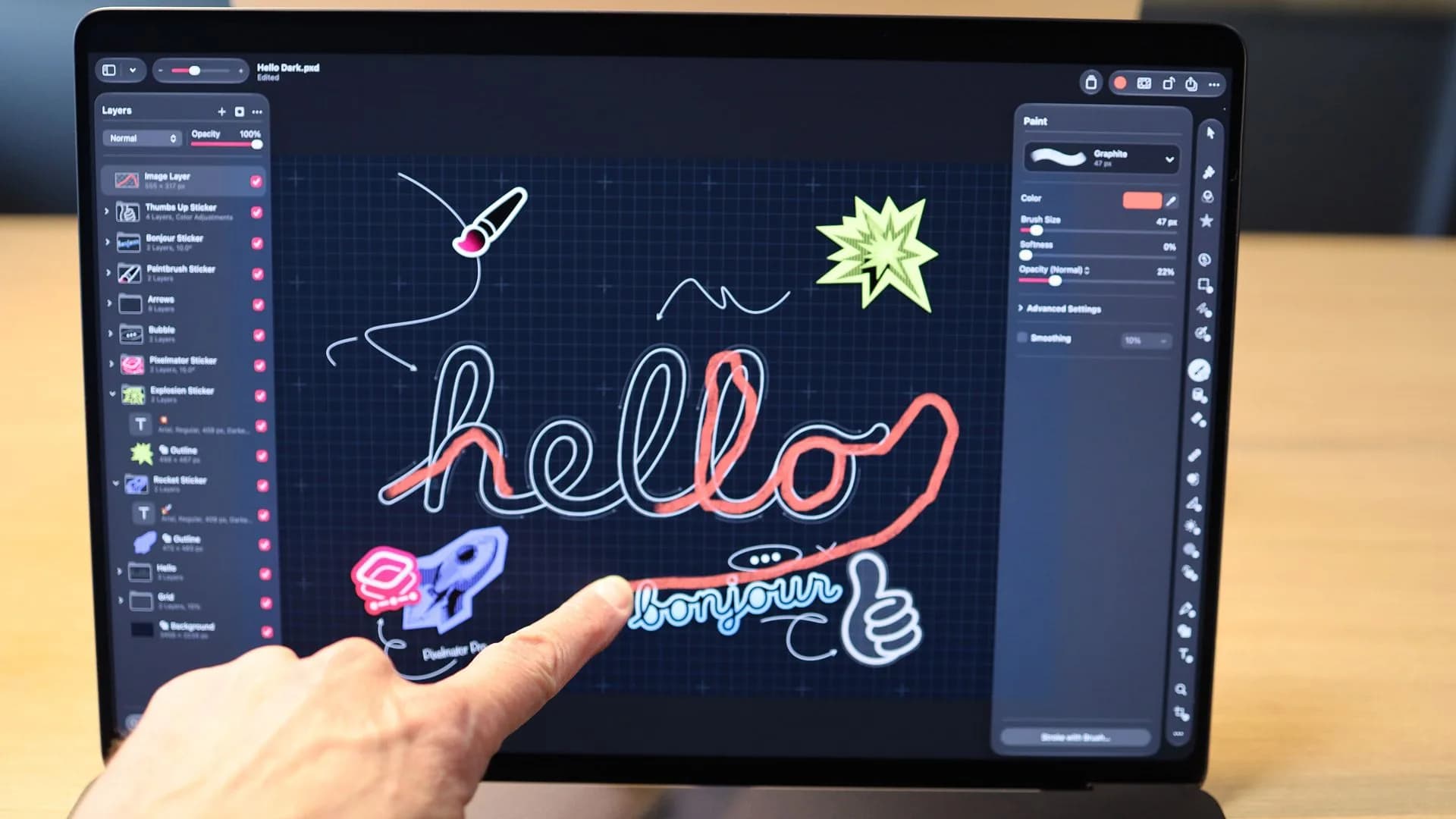 Close-up of a MacBook Pro display showing a bright, high-contrast image with a reflection of a touch interaction on the screen.