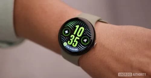 Google Pixel Watch 5 in the Olive colorway shown with its round display active
