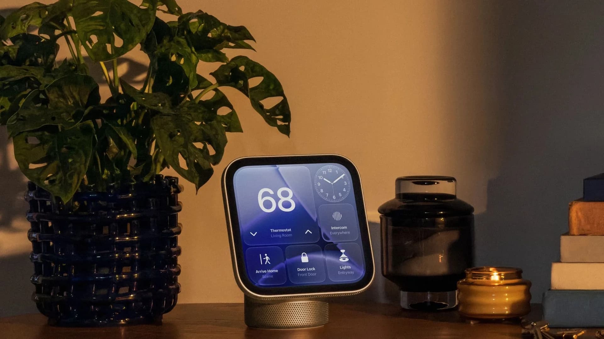Apple HomeView smart display tilted on its tabletop base in space grey finish